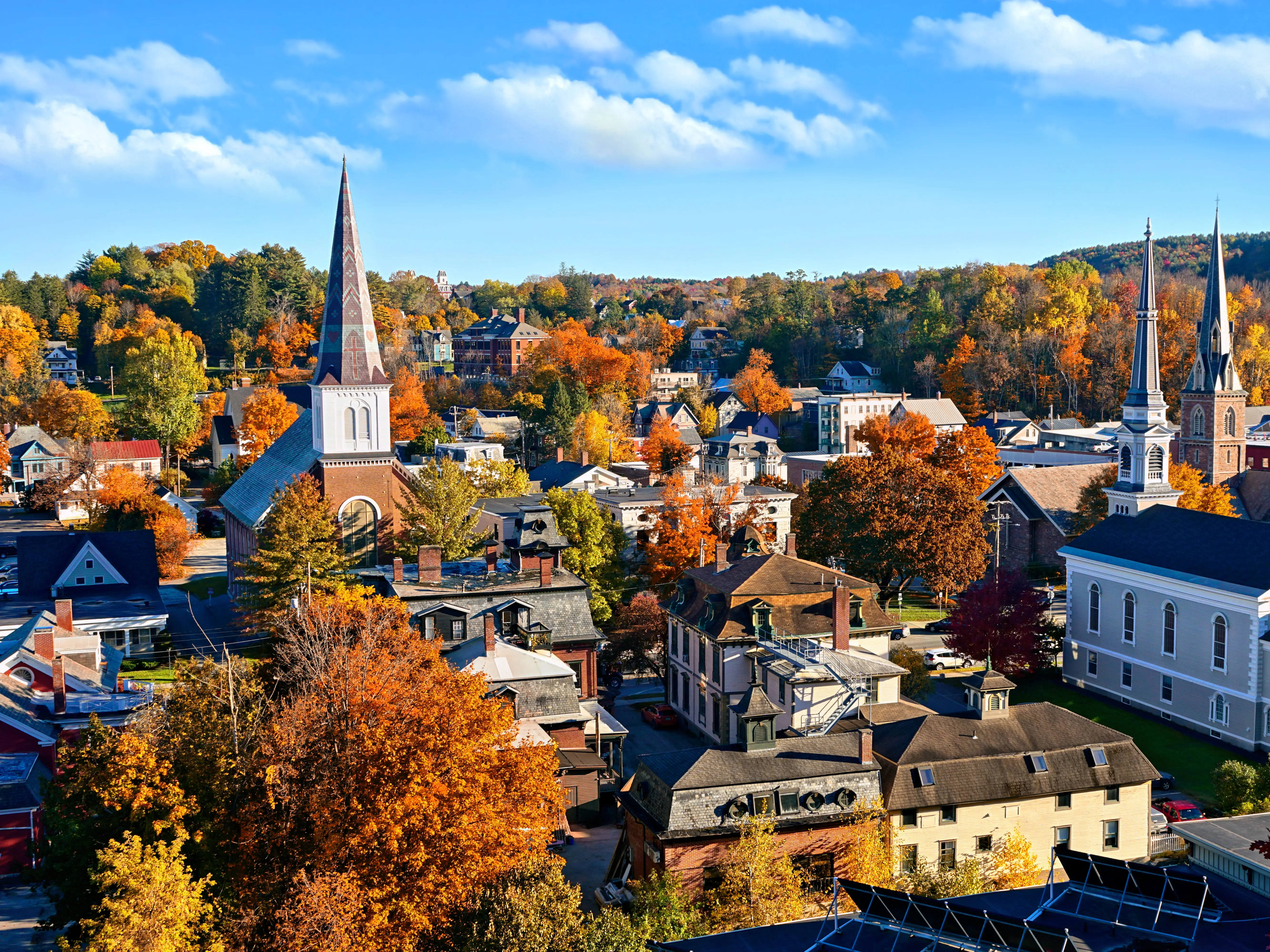 Autumn view over the historic city of Montpelier, Vermont, USA with church spires and colorful fall leaves