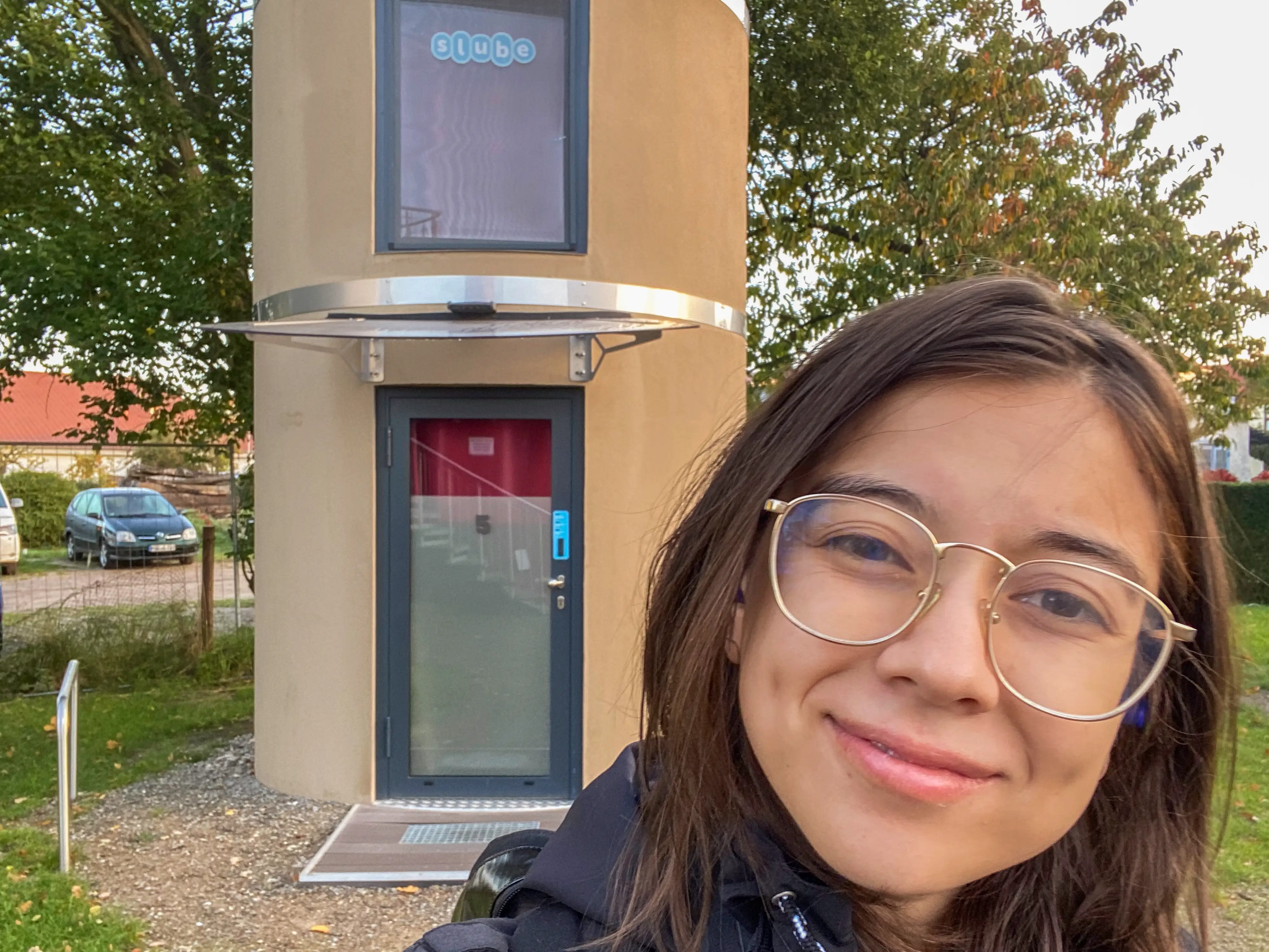 The author in front of her slube with a seemless check-in process.