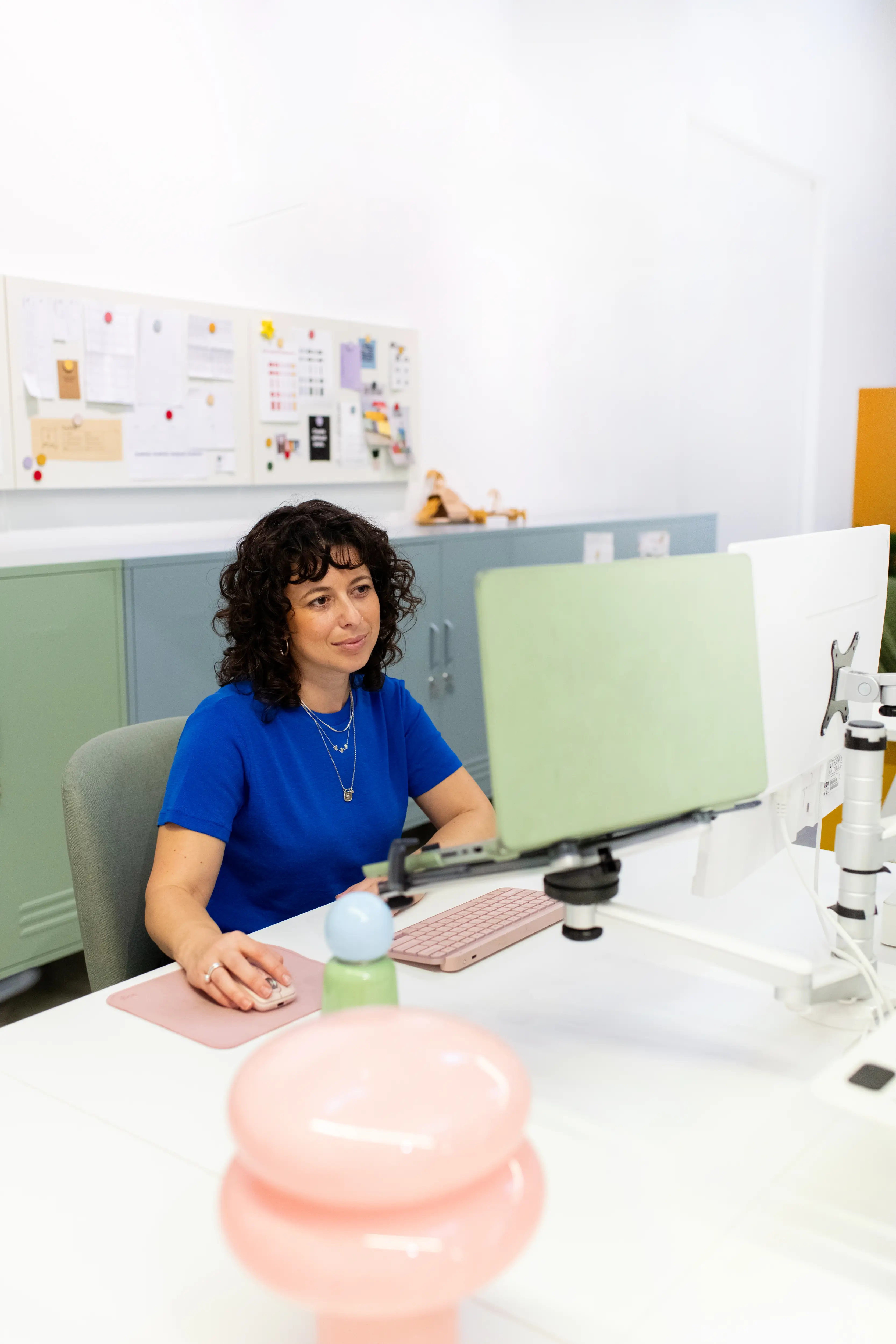 Becca Stern, co-founder of Mustard Made, sits at her office desk.
