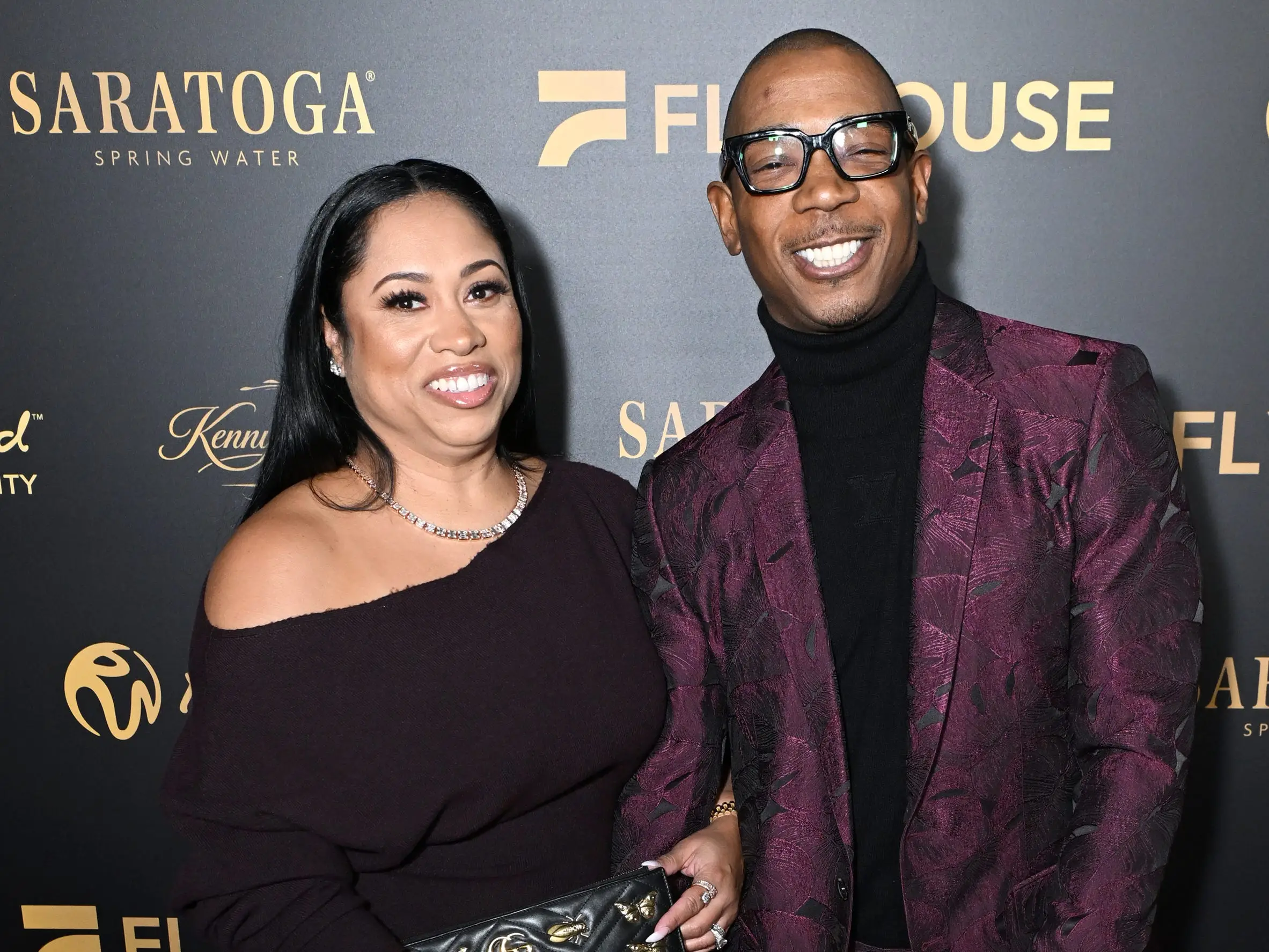 Aisha Atkins and Ja Rule attend Kenny 