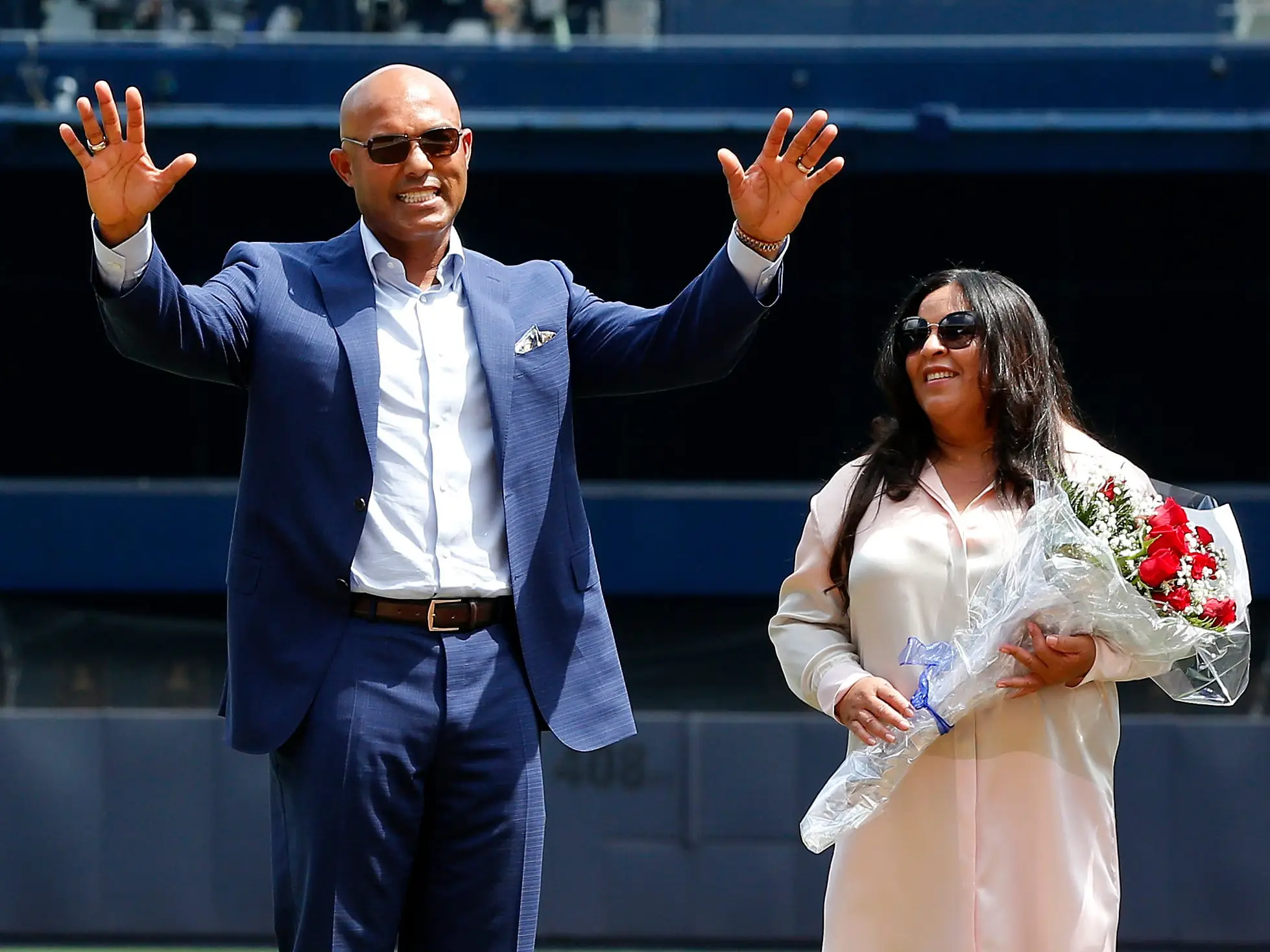 2019 National Baseball Hall of Fame inductee and former New York Yankee Mariano Rivera acknowledges the crowd as he stands with his wife Clara next to his Hall of Fame plaque during a ceremony in his honor before a game between the Yankees and the Cleveland Indians at Yankee Stadium on August