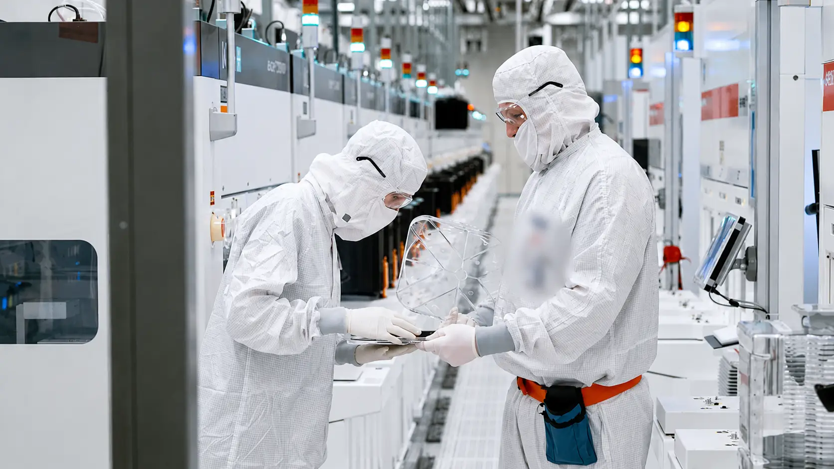 Business Insider producer visits Intel's most advanced chip plant and holds a wafer.