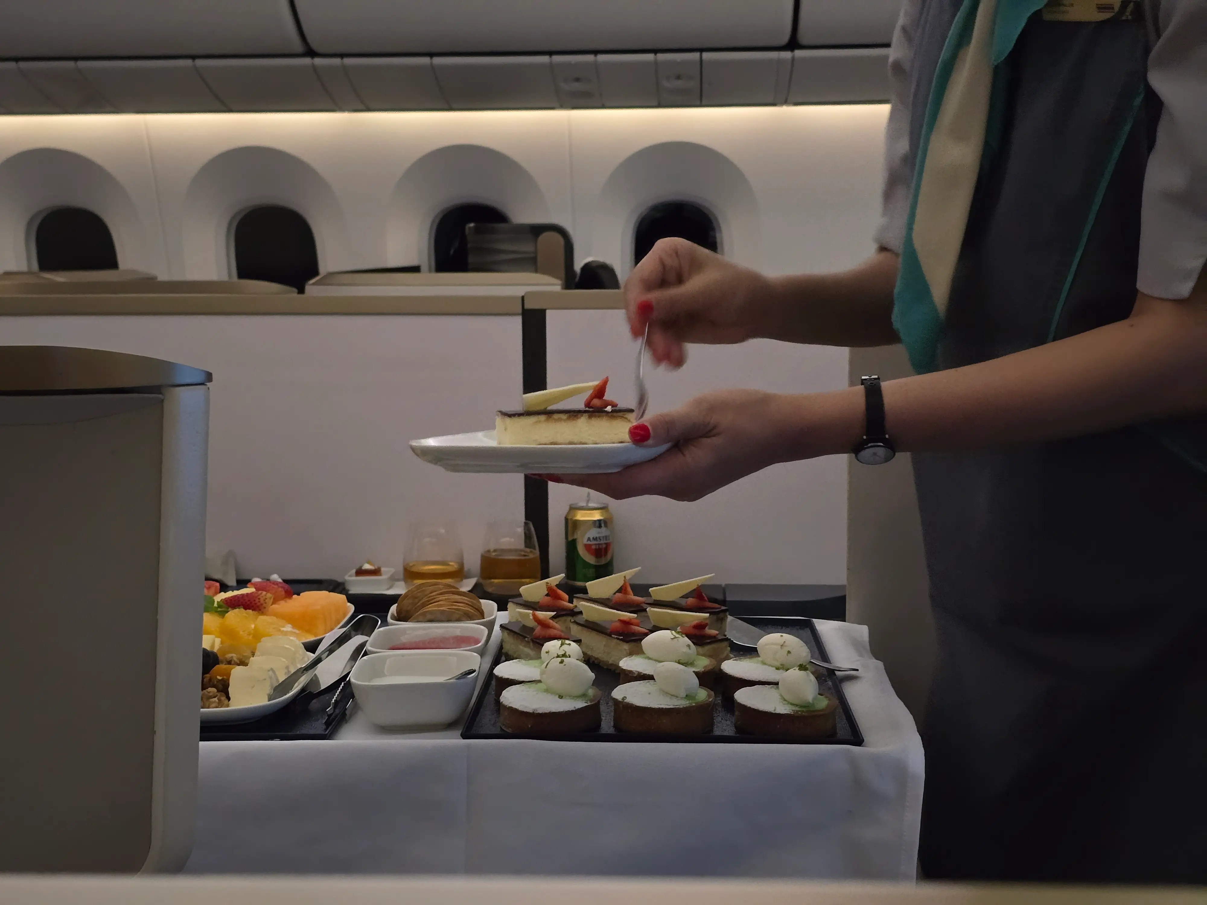 Flight attendant making the dessert.