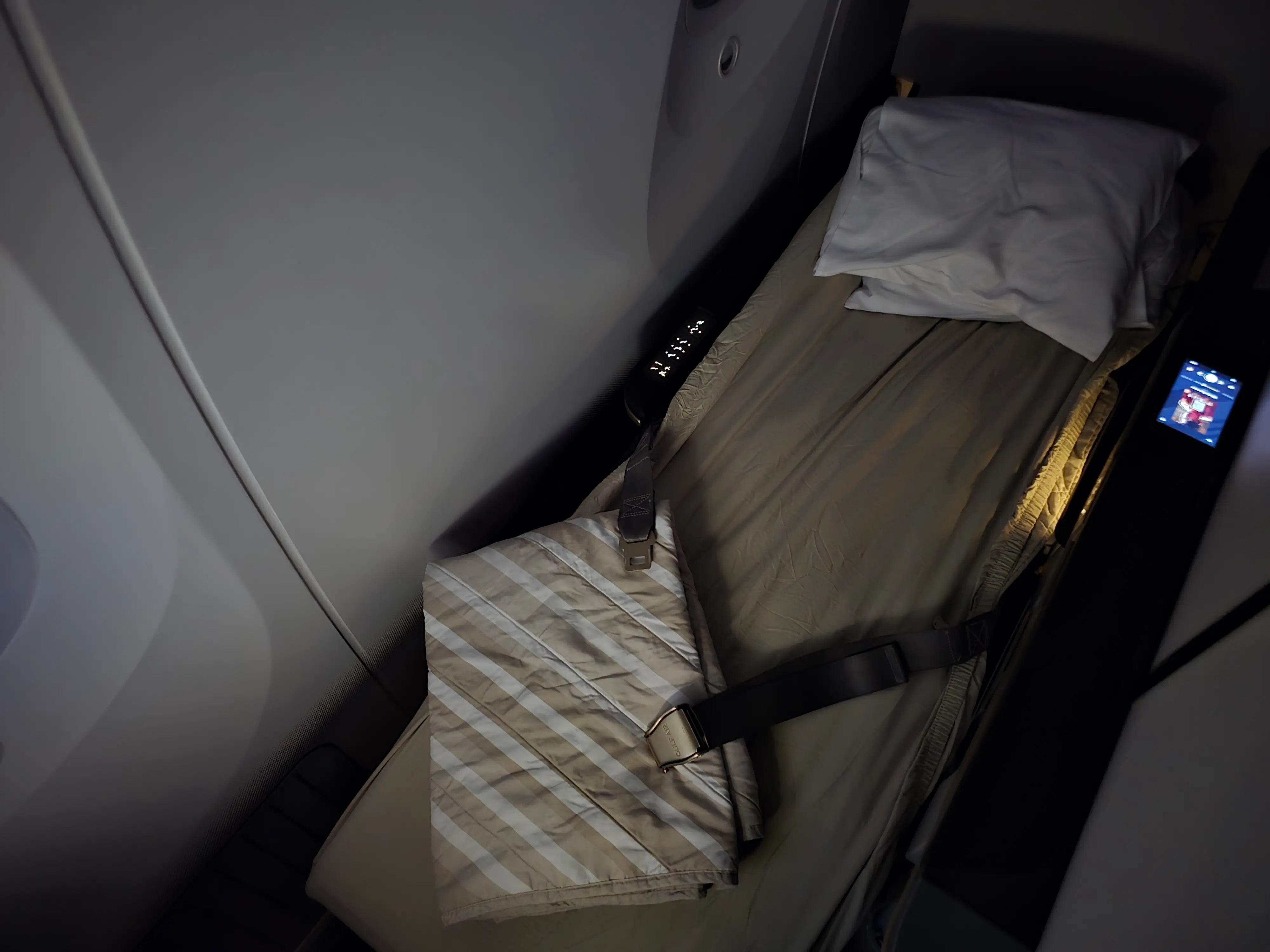 Gulf Air 787 business class bed in lie-flat mode.