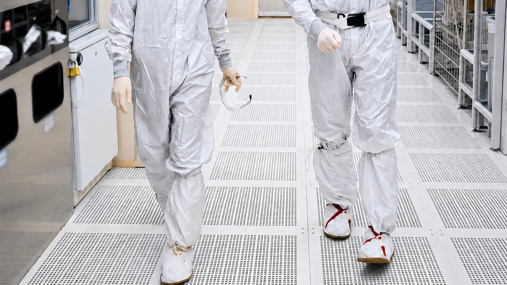 Producer Olivia Nemec and Intel's Chris Auth walk on a ventilated floor.