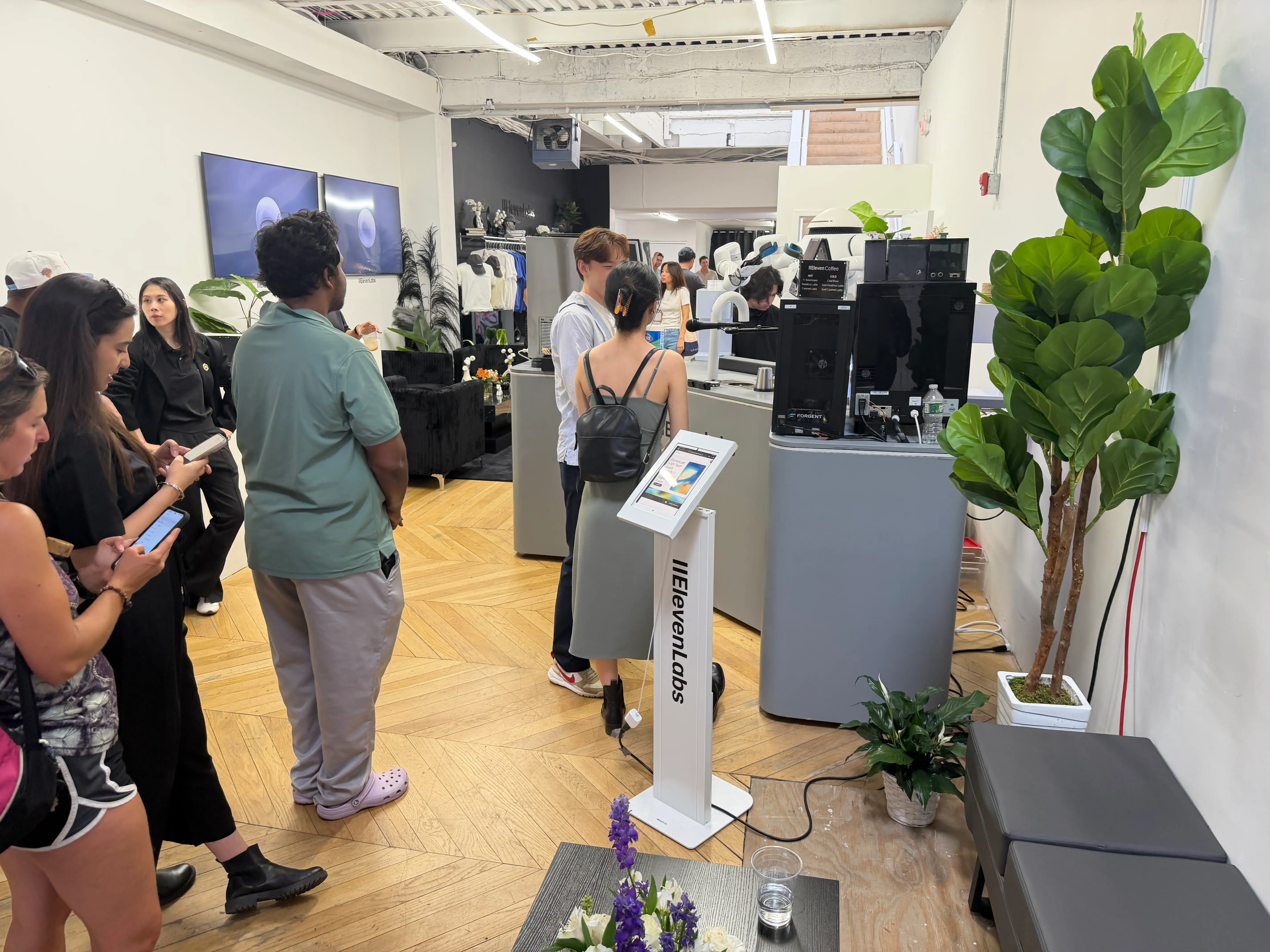 The line for coffee at the ElevenLabs pop-up is pictured.