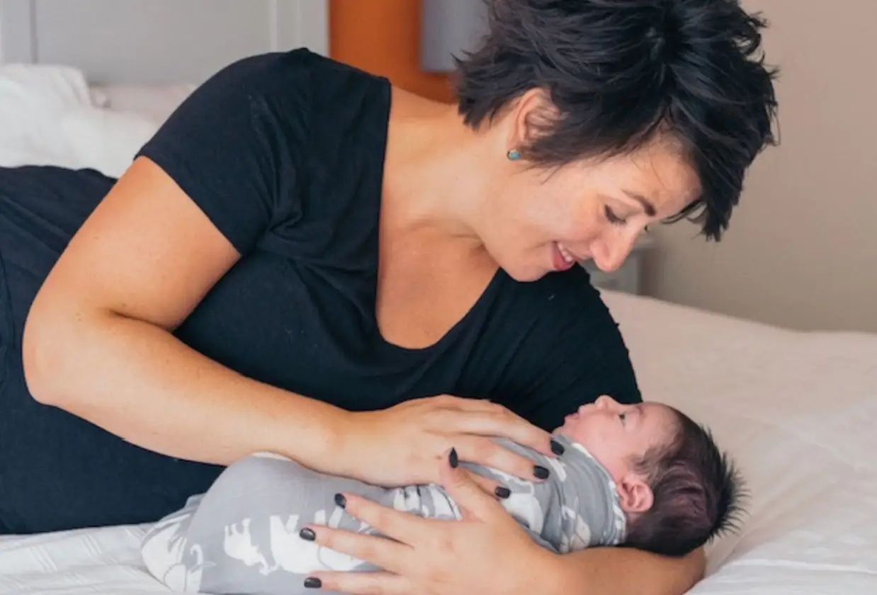 Woman staring at new baby