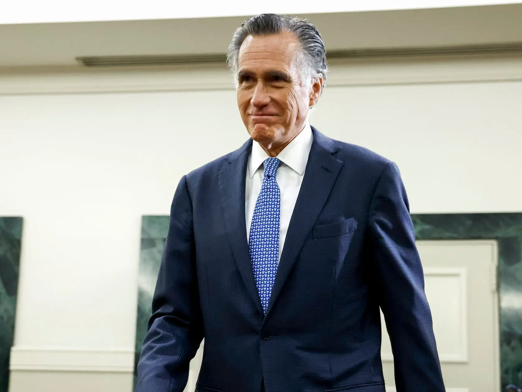 Mitt Romney walks around in the US Capital
