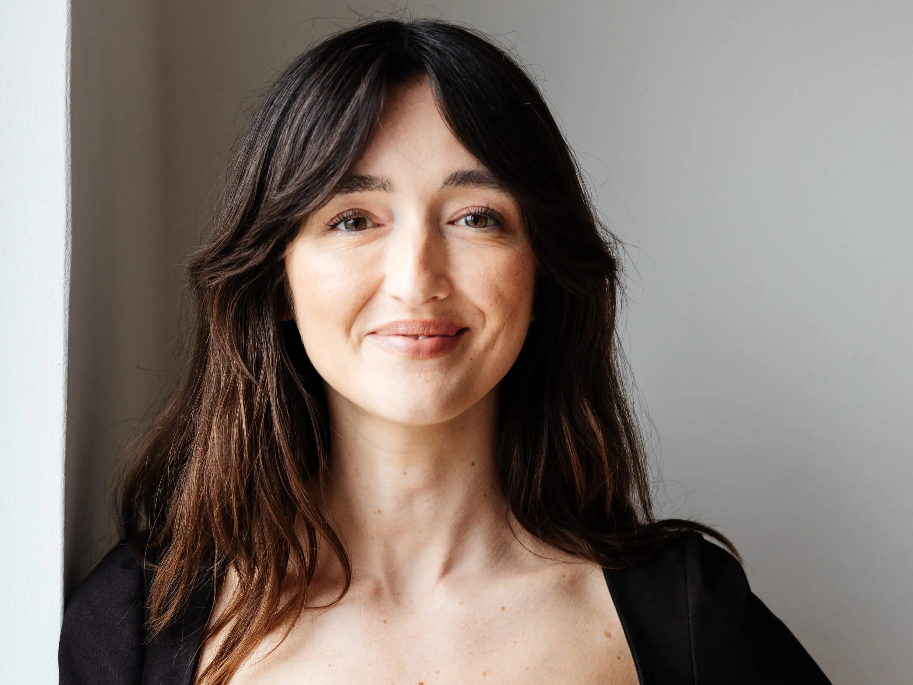 A woman with brown hair.