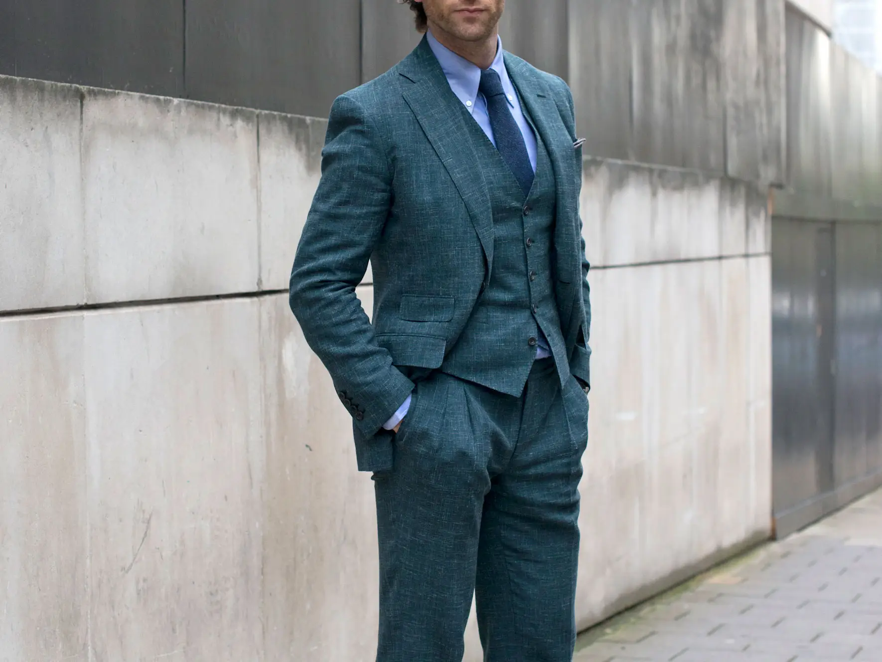 A man wearing a three-piece suit.