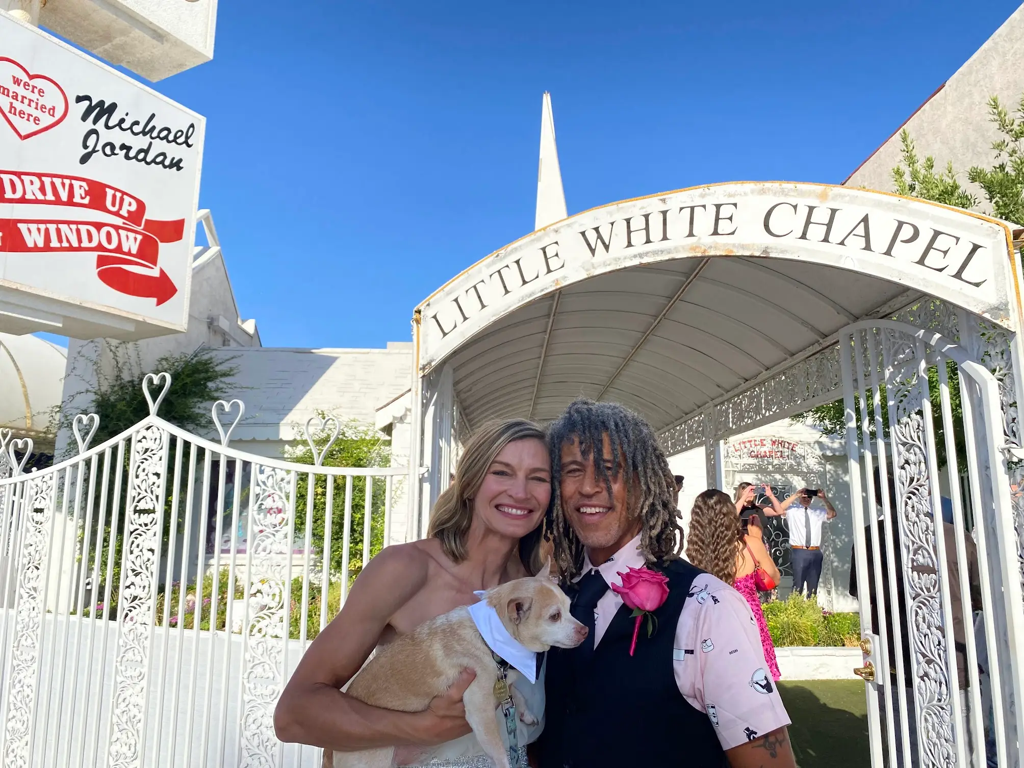 Man and woman smiling in front of Little White Chapel