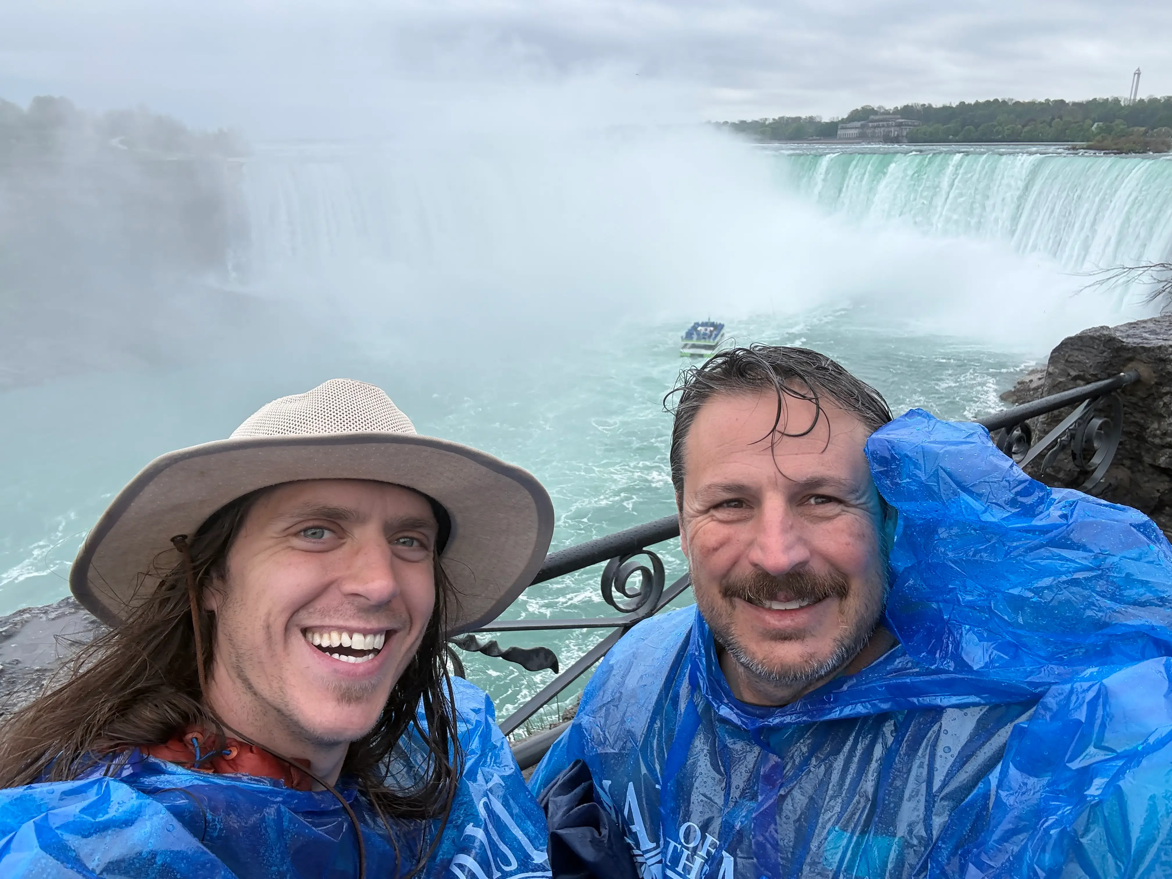 Two men in ponchos at Niagara Falls