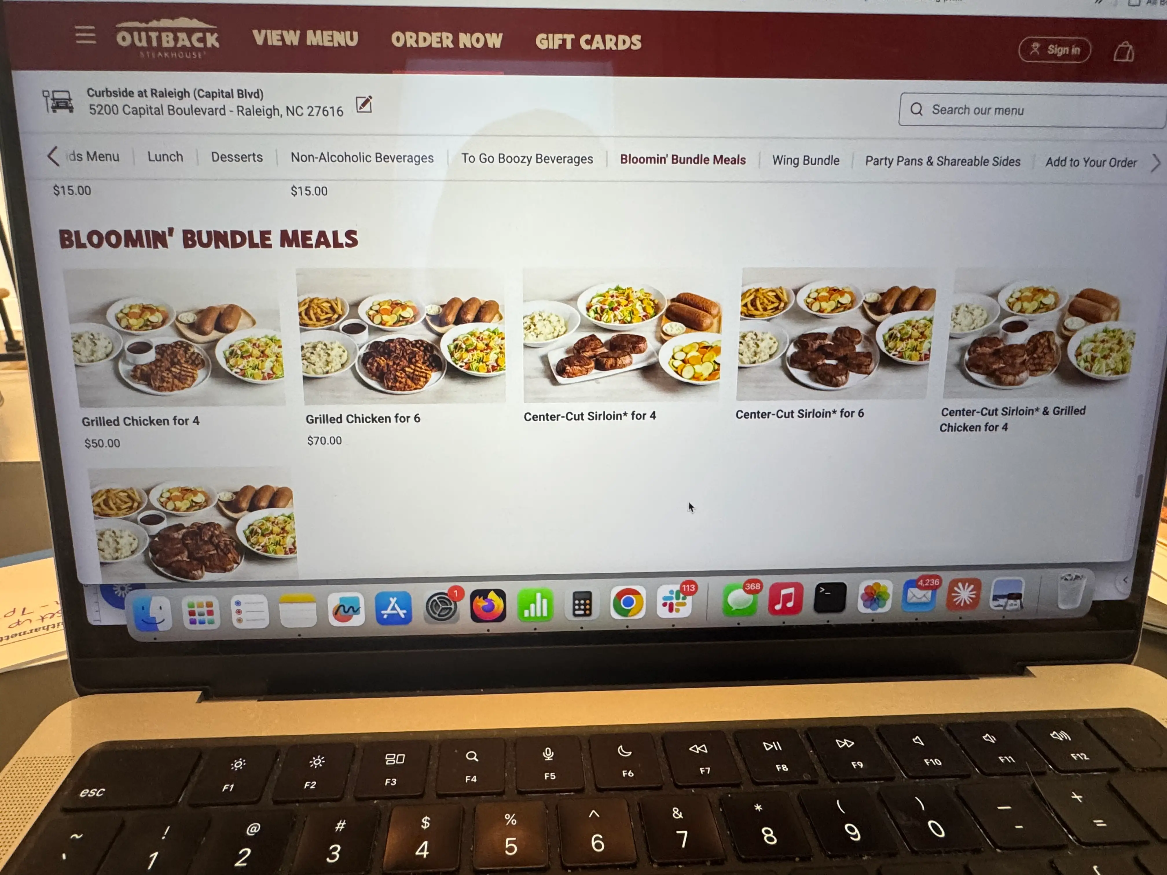 Photo of computer screenshowing bloomin' bundle meal options at outback