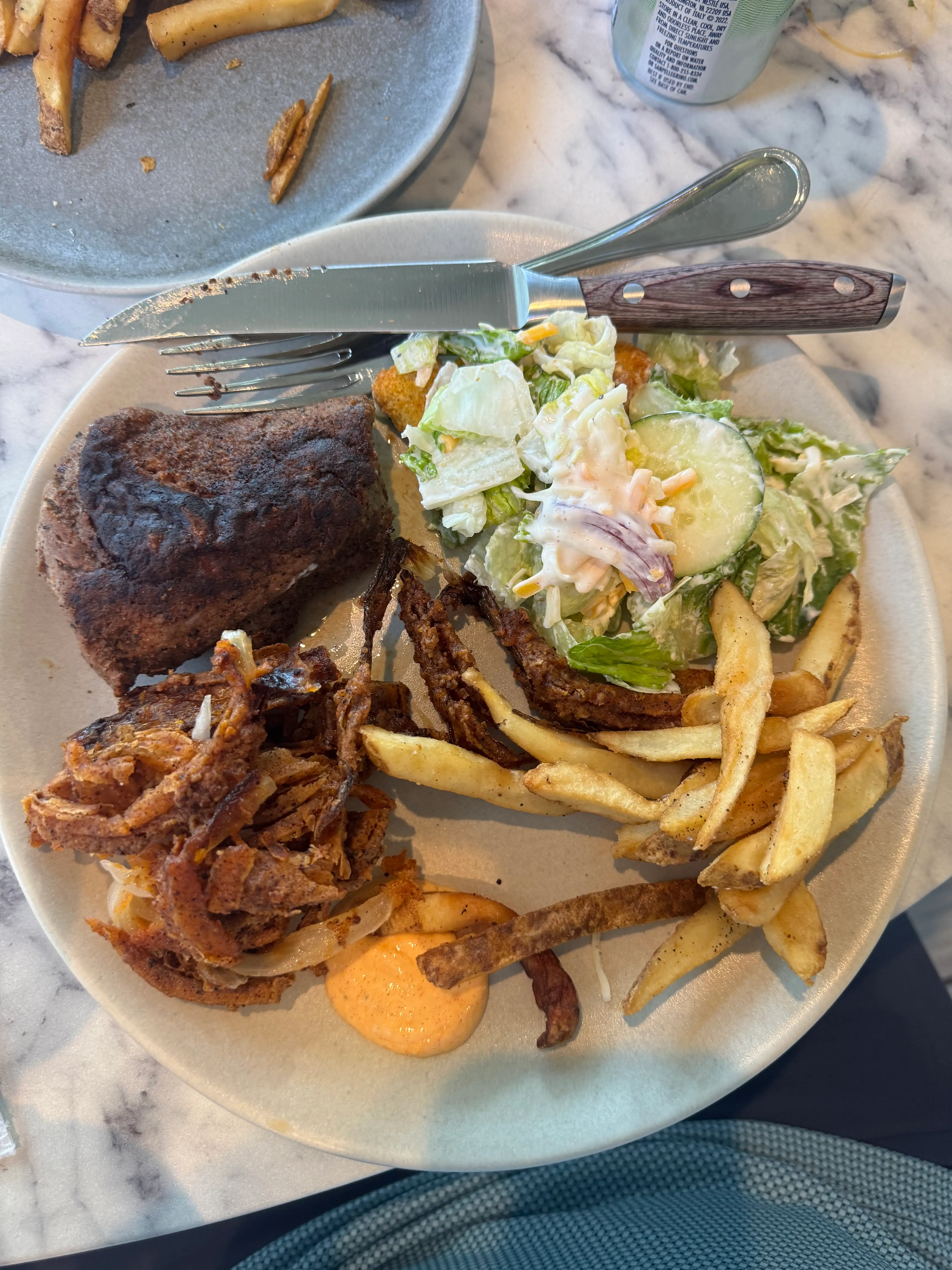 Plate with fries, steak, salad, bread