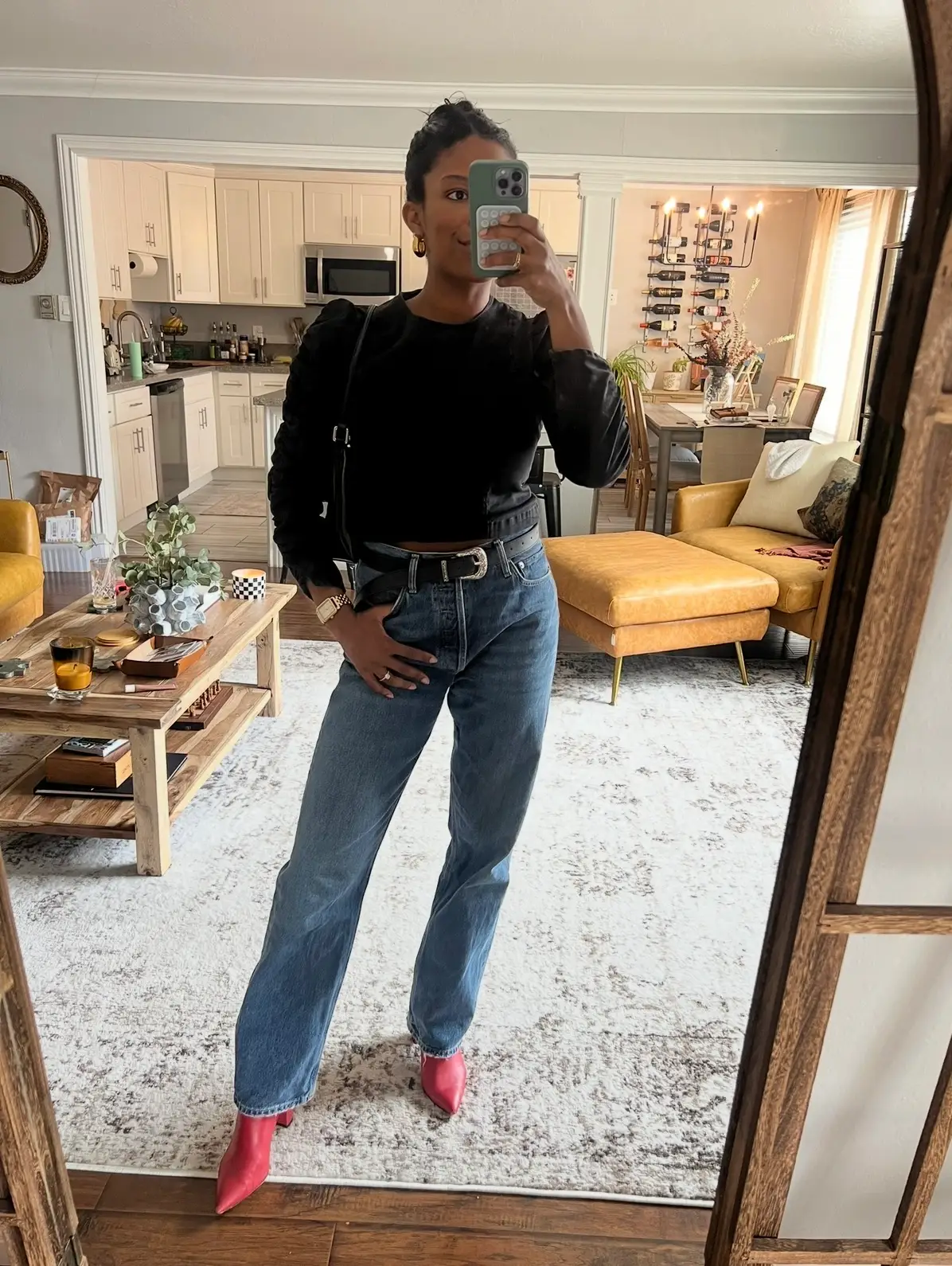 A woman taking a selfie in a mirror.