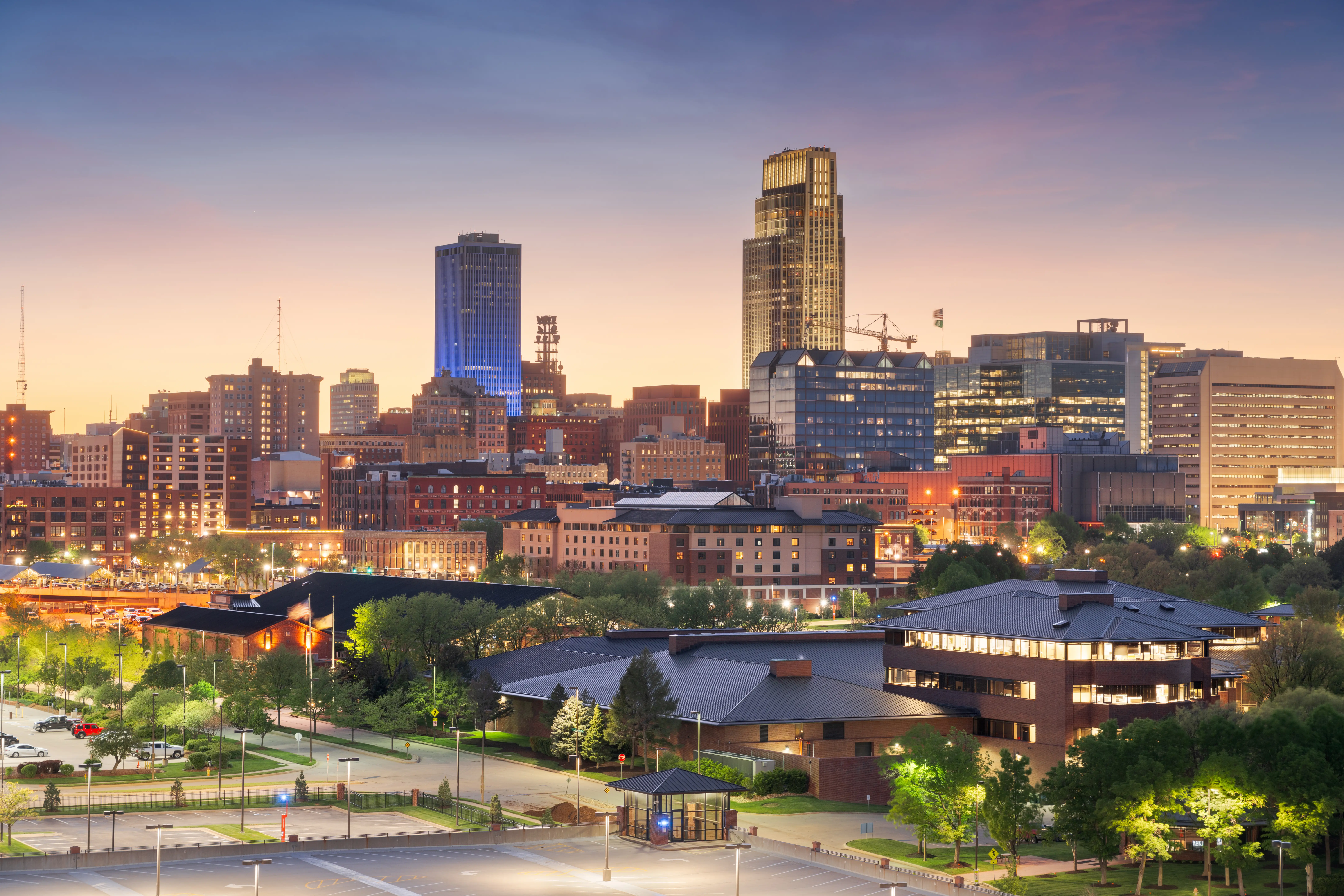 Omaha, Nebraska, USA downtown cityscape at dusk.