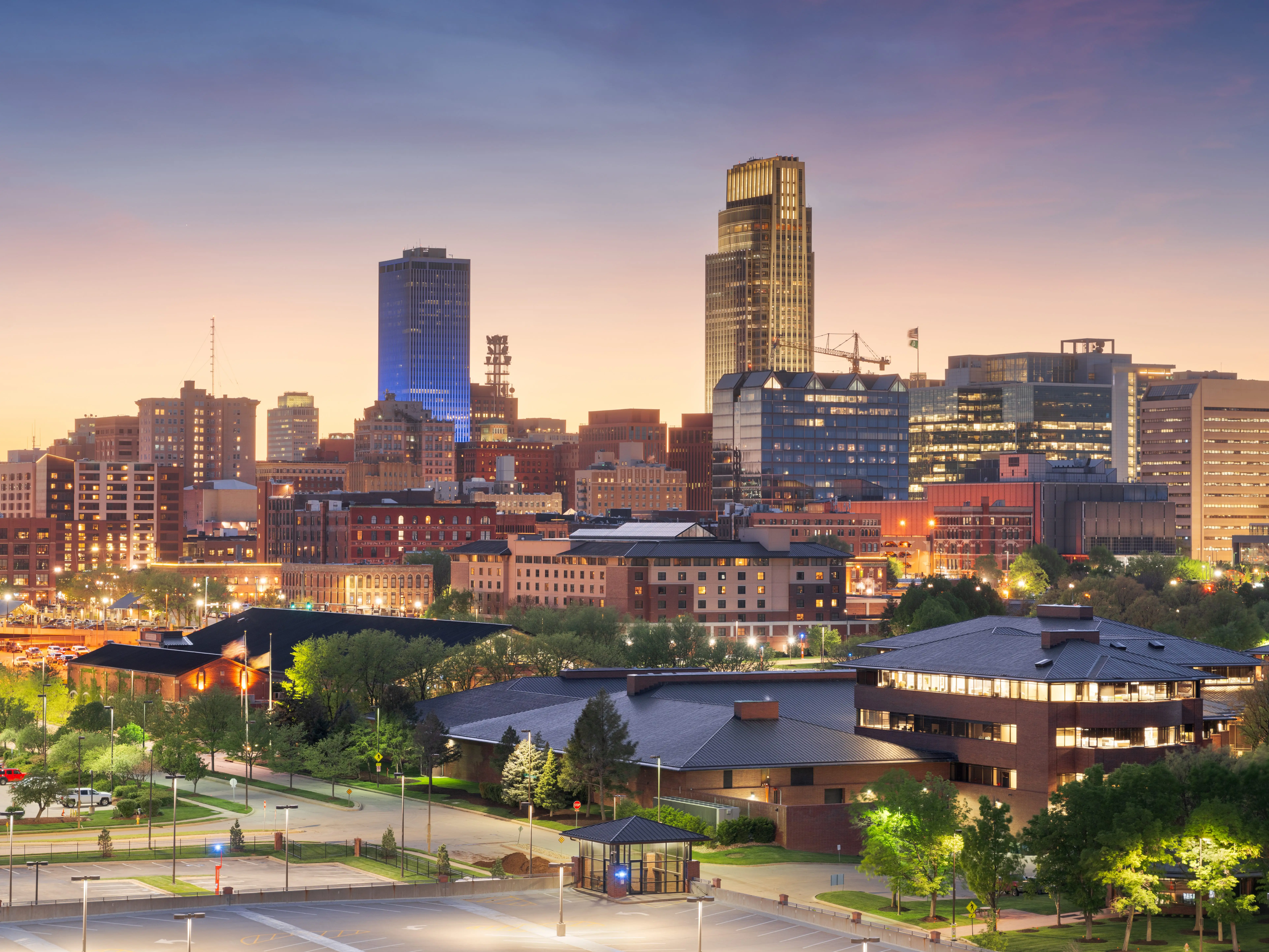 Omaha, Nebraska, USA downtown cityscape at dusk.