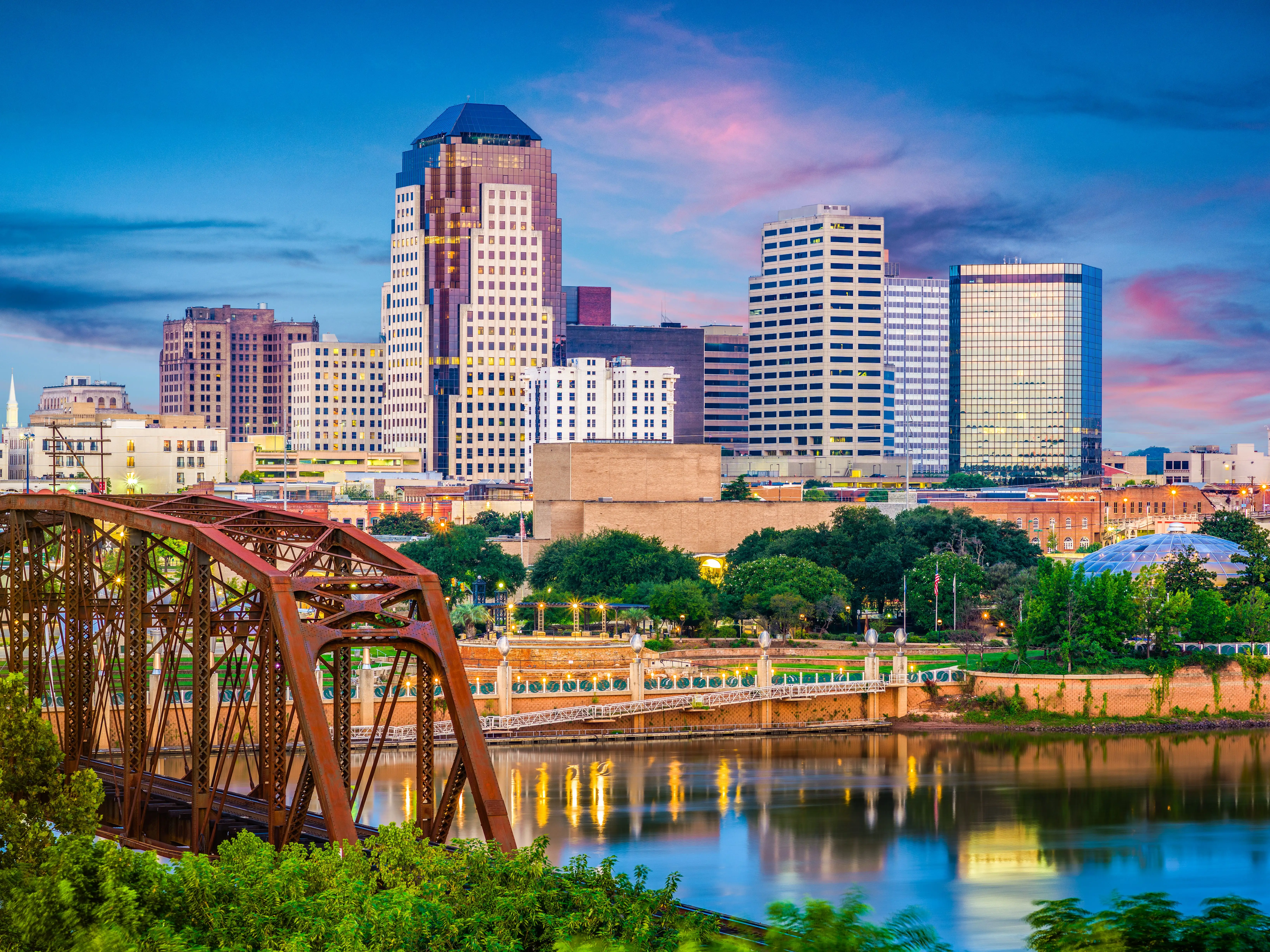 Shreveport, Louisiana, USA skyline over the Red River at dusk.