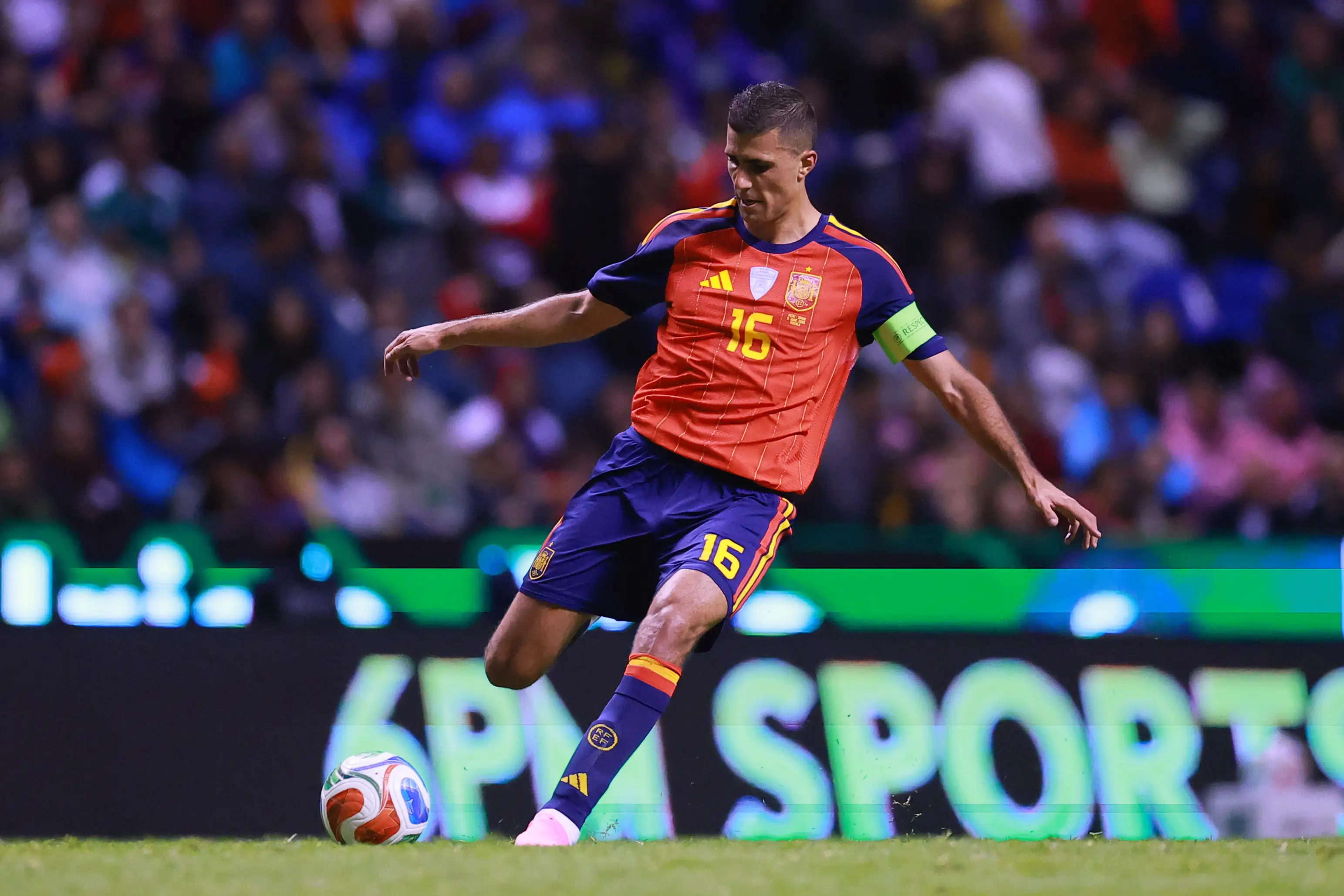 Rodri of Spain kicks the ball.