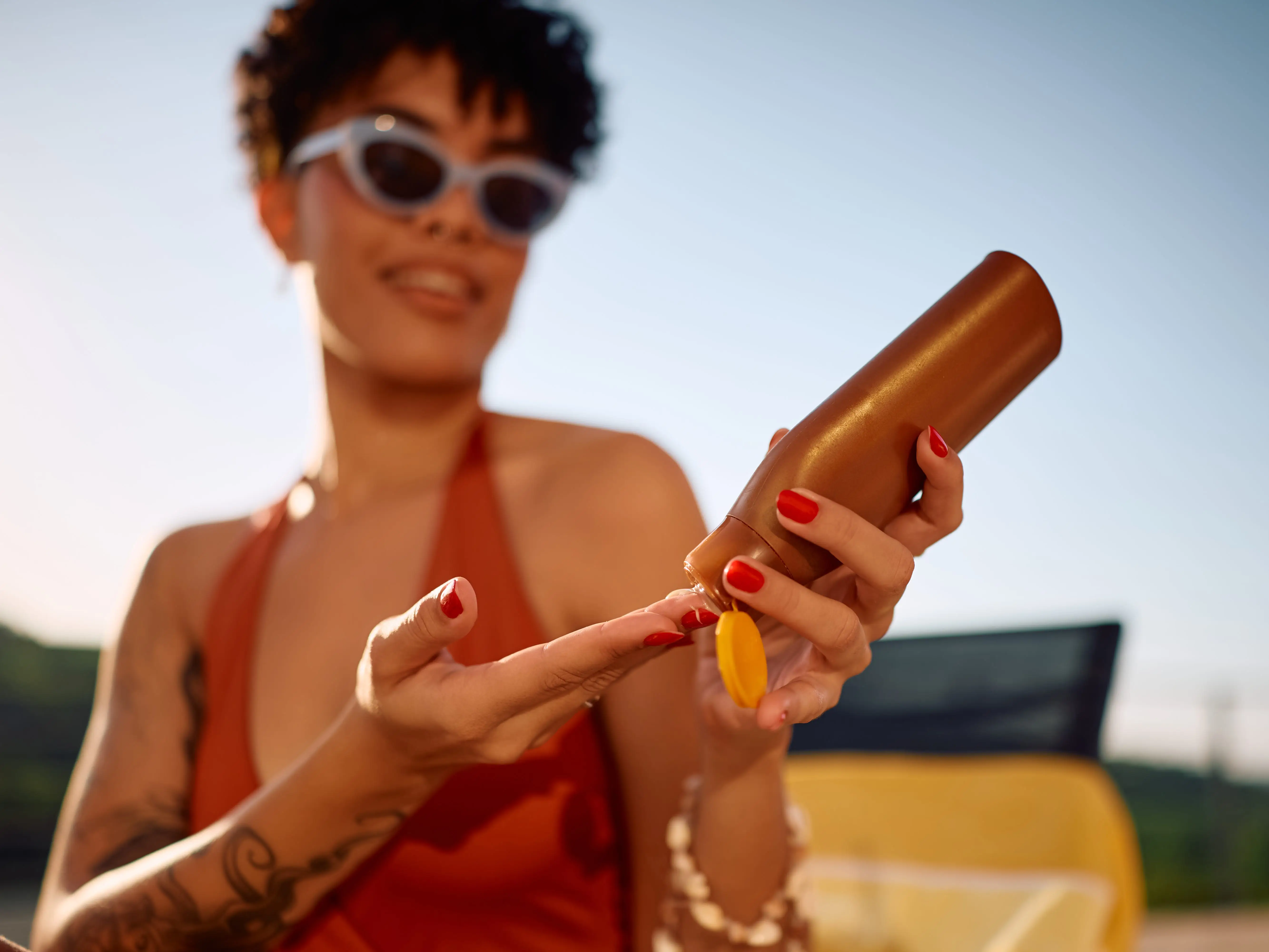 Woman applying sunscreen
