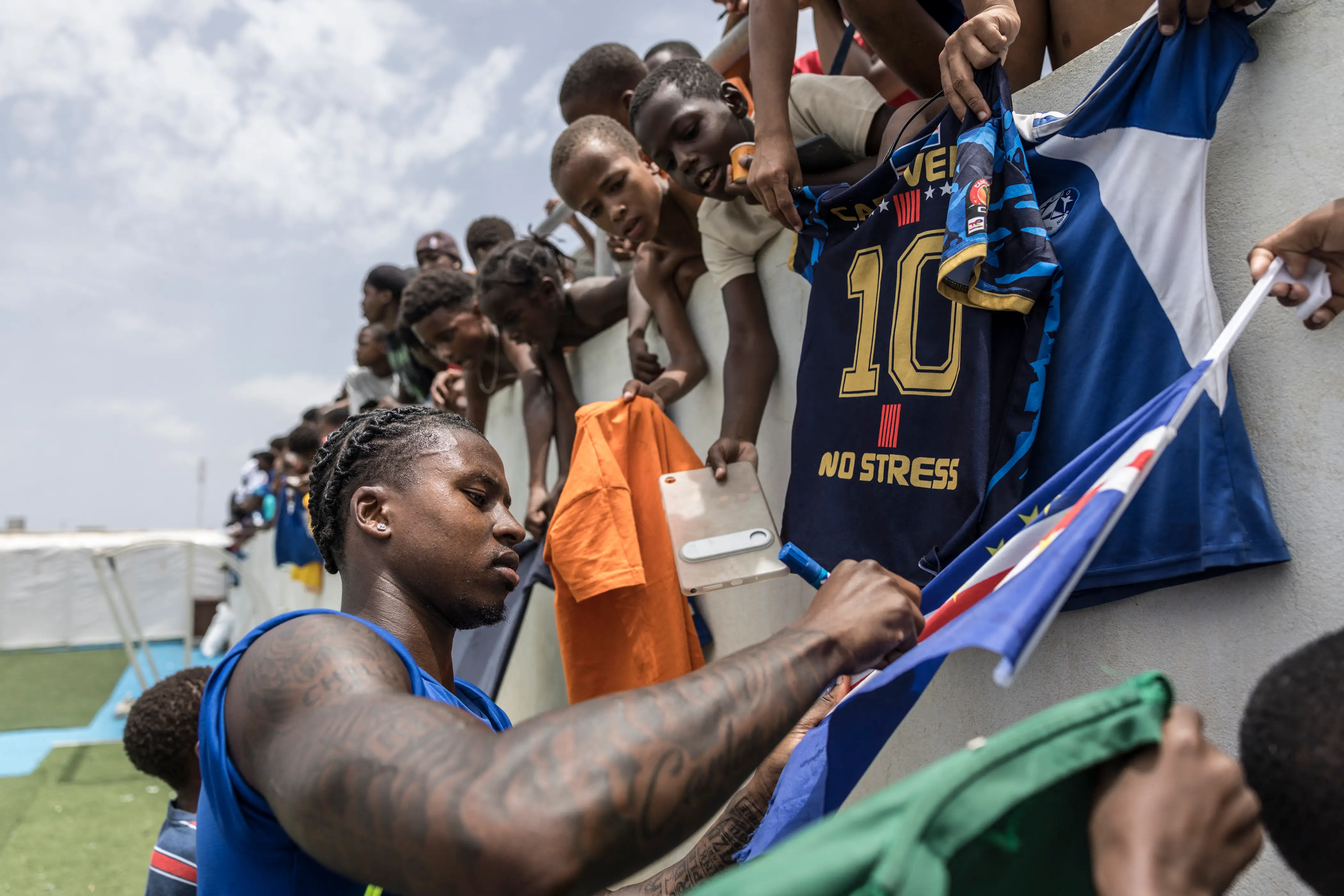 Cabo Verde player signs flag.