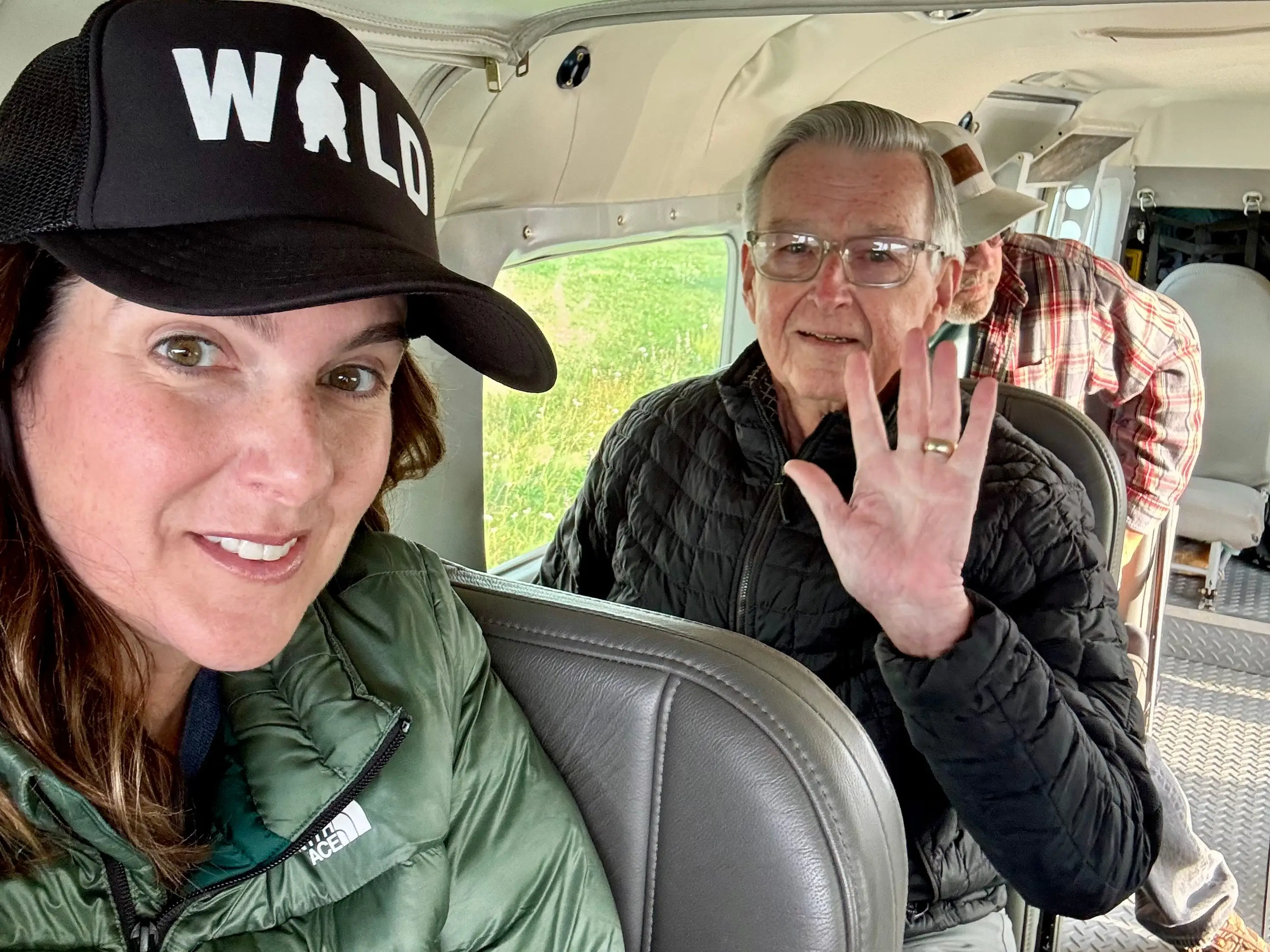 a father and daughter inside a seaplane in Alaska.