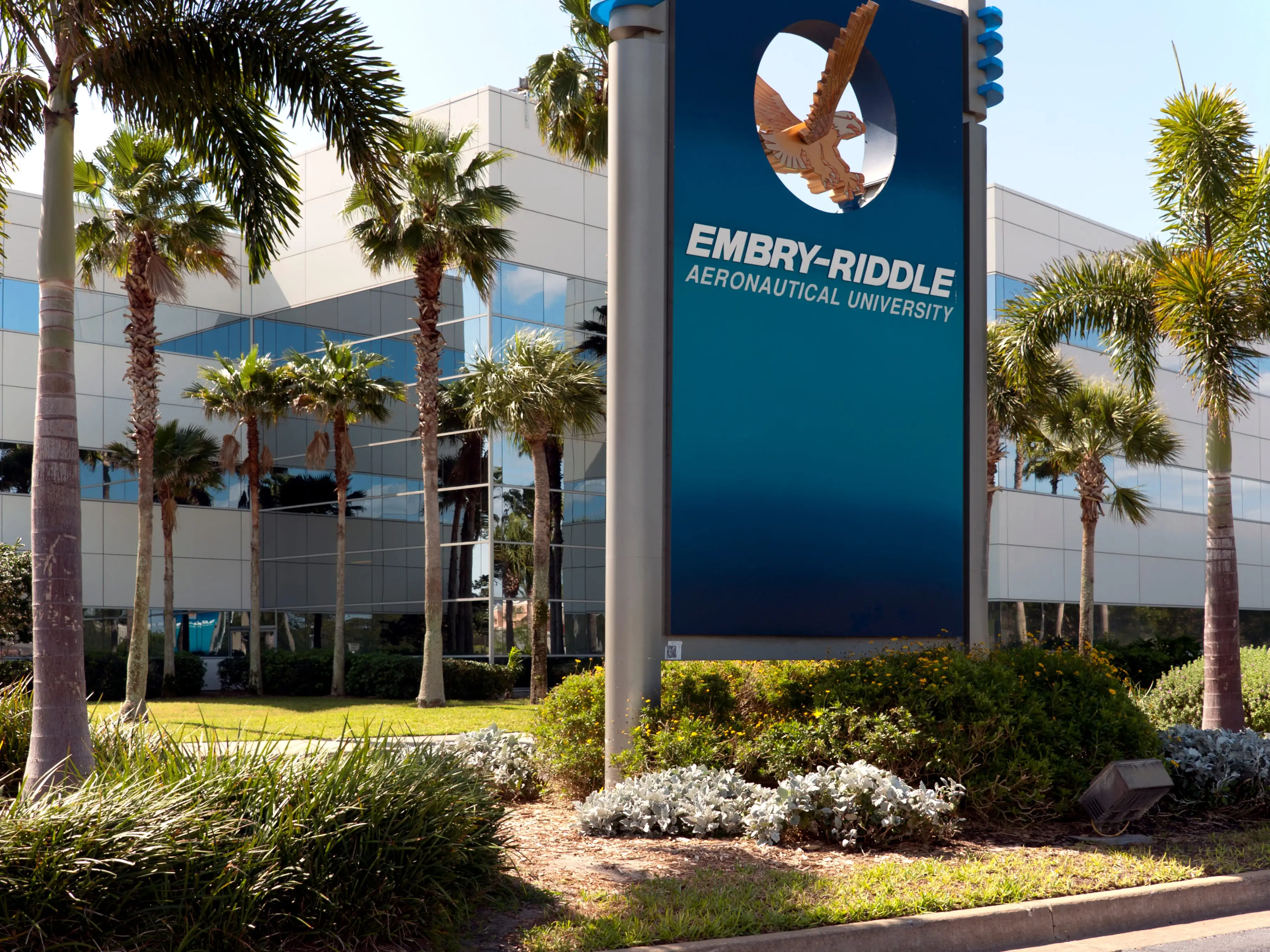 Daytona Beach, FL, USA - April 07, 2012: Campus sign in foreground, with Lehman building in background, palm trees, bright sunny day, partial shot of building and sign, close shot on sign, no people