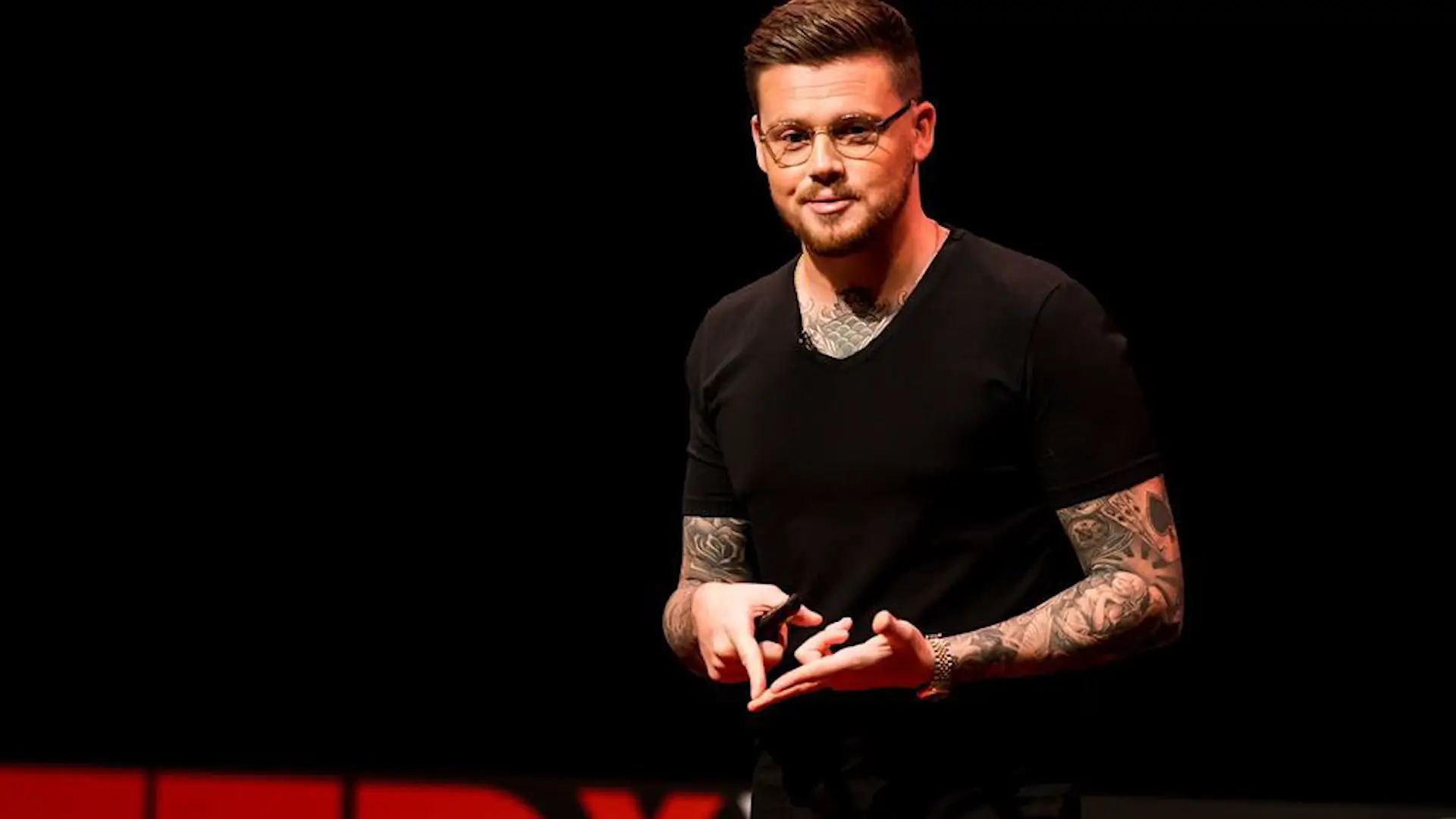 Lewis Raymond Taylor giving a TEDx talk.