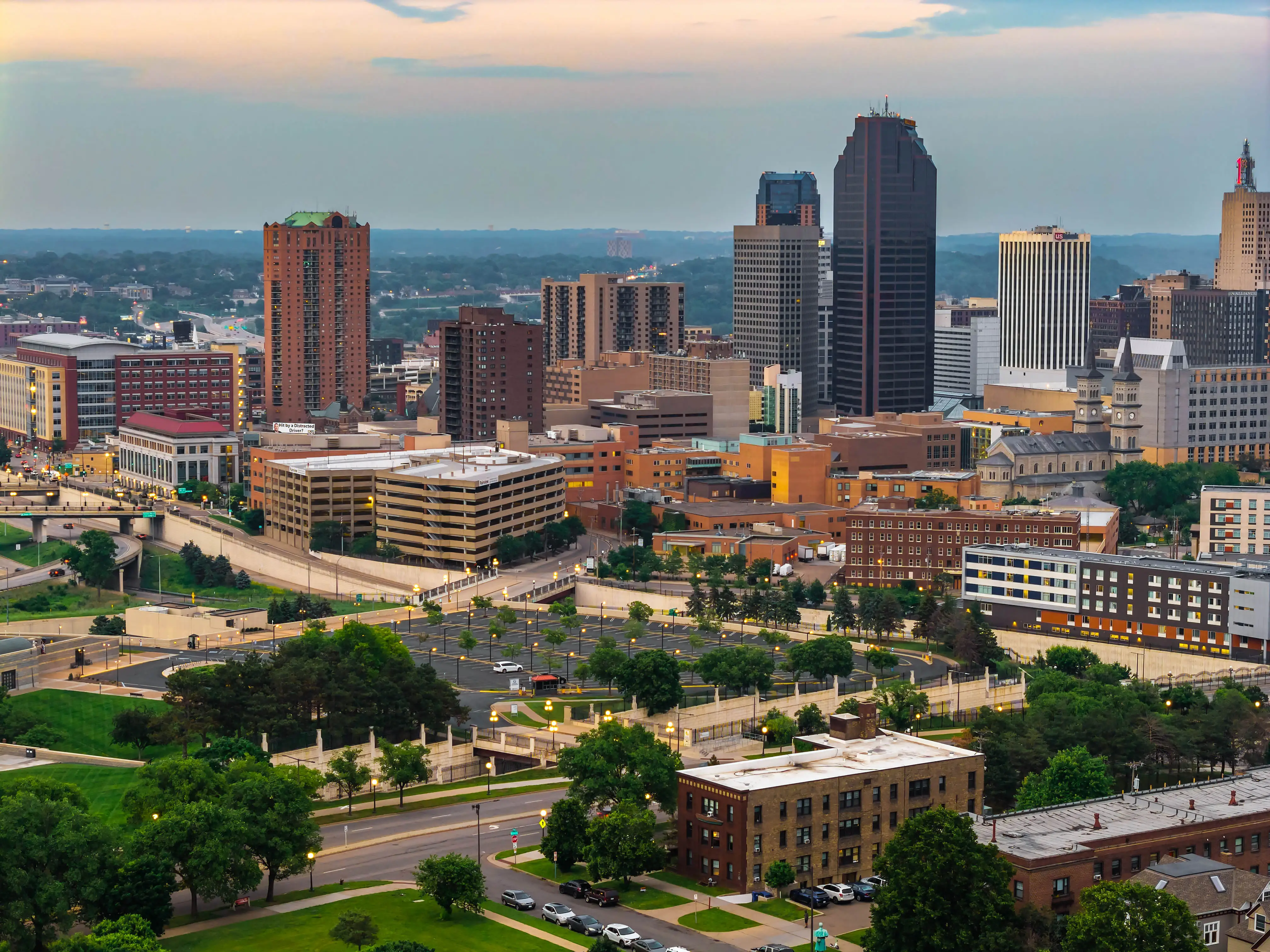 St Paul, MN, USA - June 07, 2025: An aerial view of the illuminated skyscrapers in St. Paul city center, bathed in the warm hues of sunset
