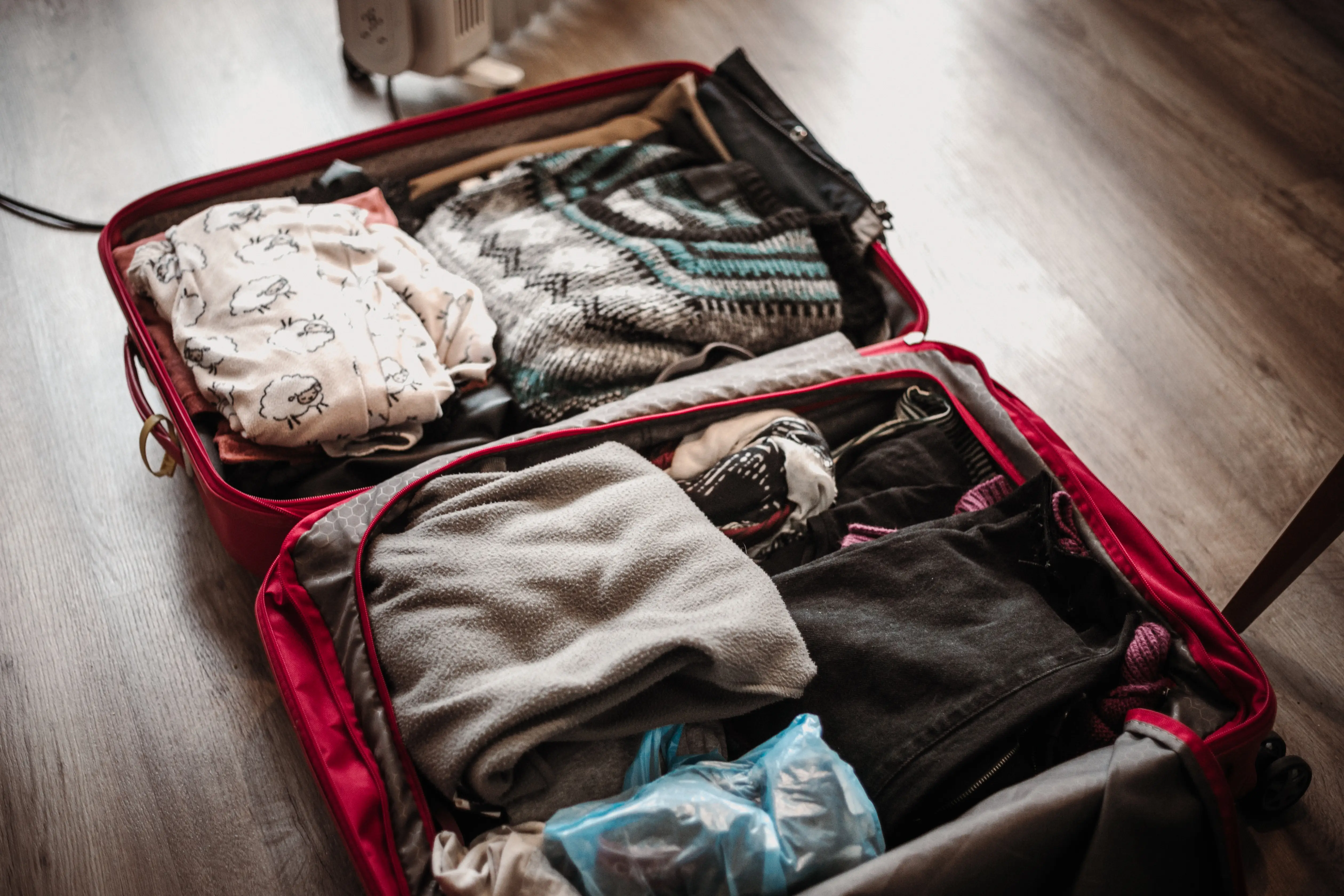 Open suitcase with clothes inside
