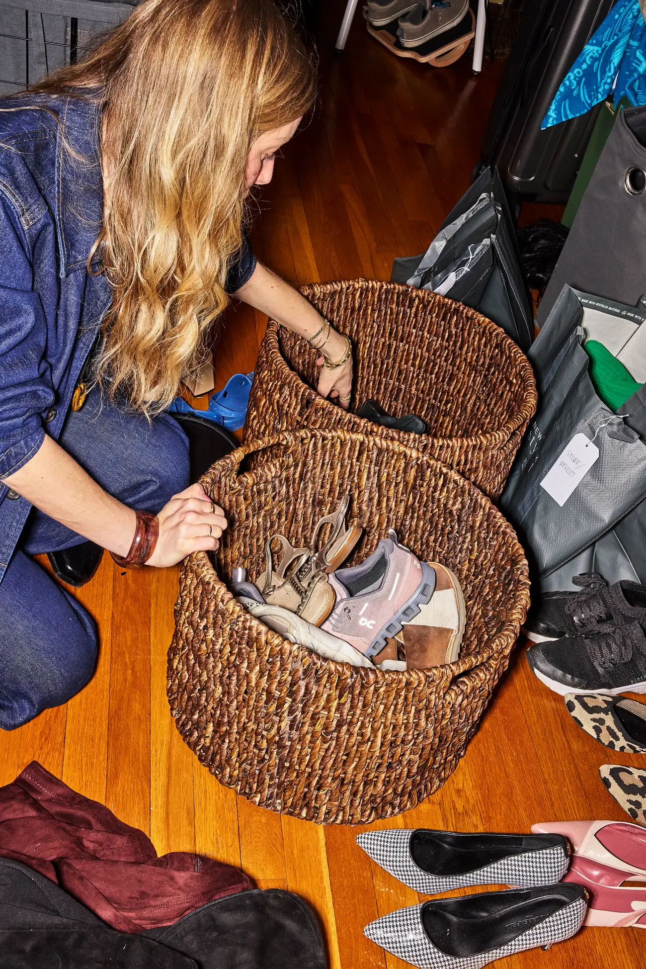 Stylist, Liz Teich, organizing Julie Kling's closet