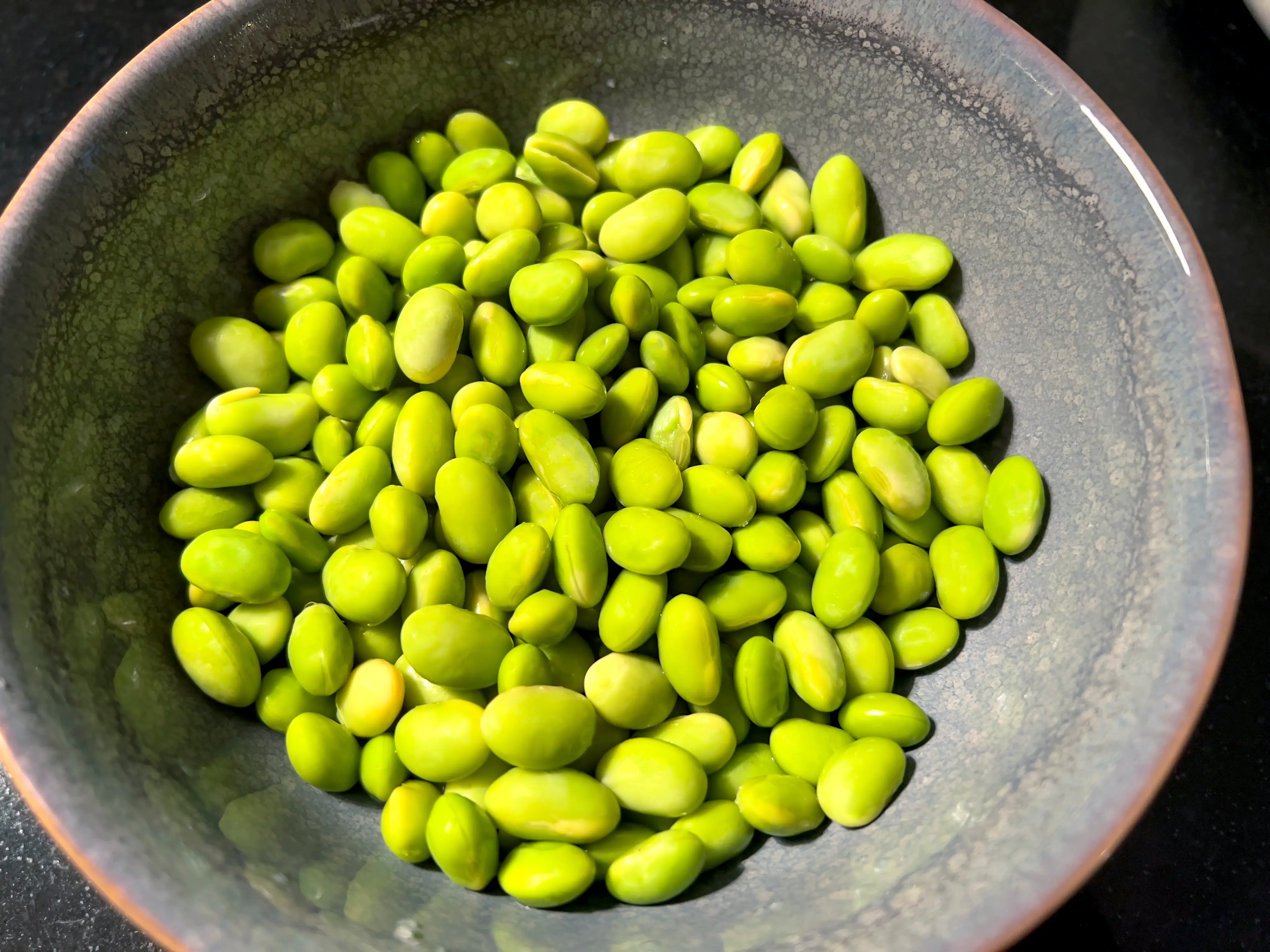 A bowl of edamame beans.