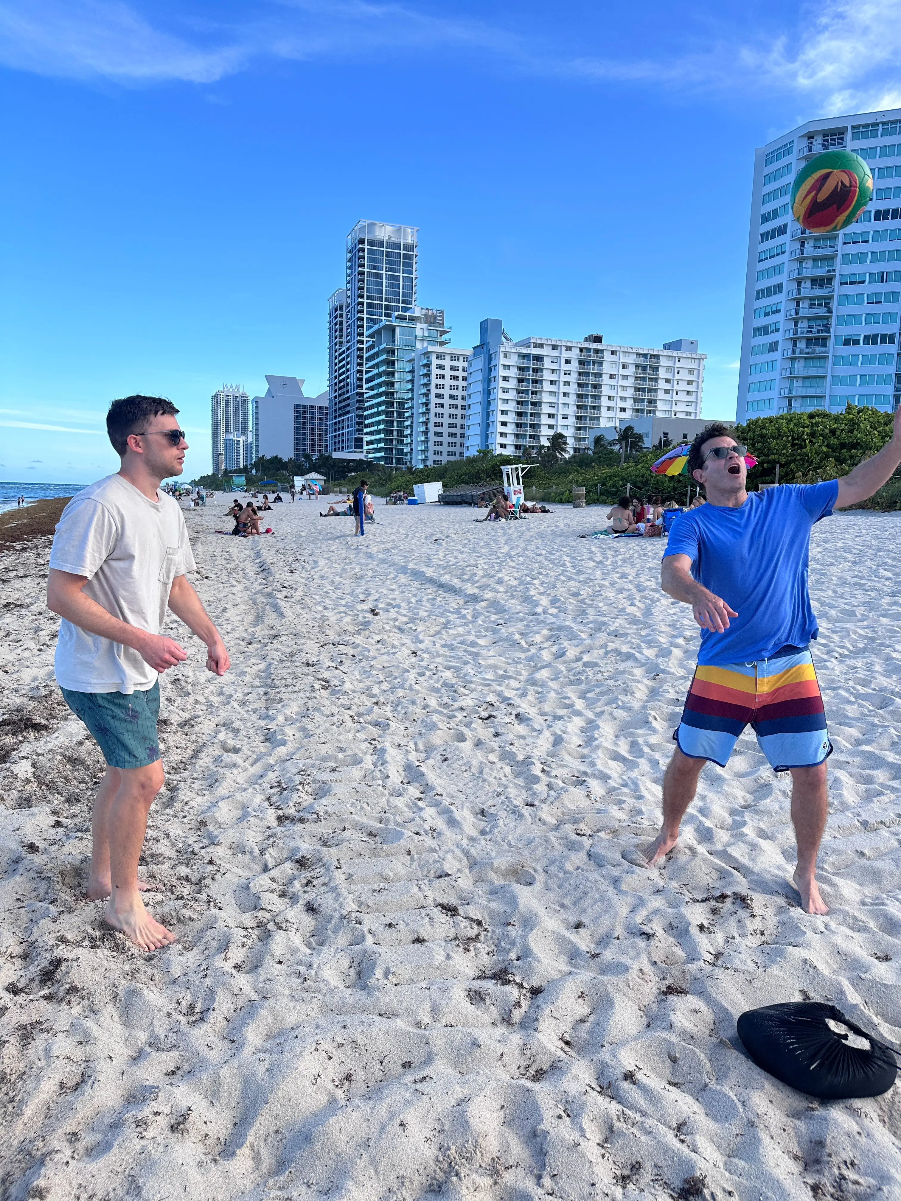 The author and his friend play with a soccer ball on Miami Beach