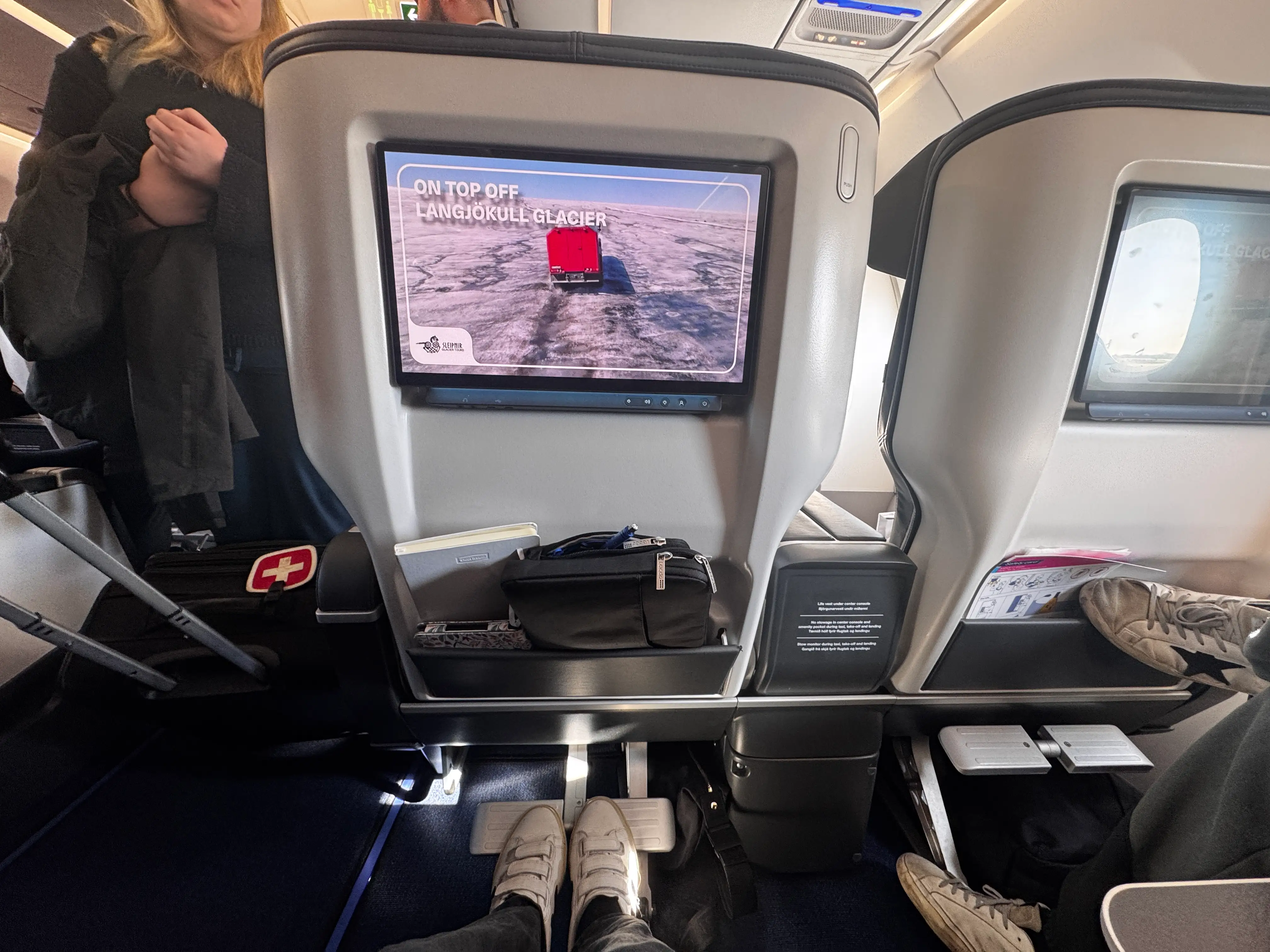 View of screenback, legroom of seat in IcelandAir Saga Premium