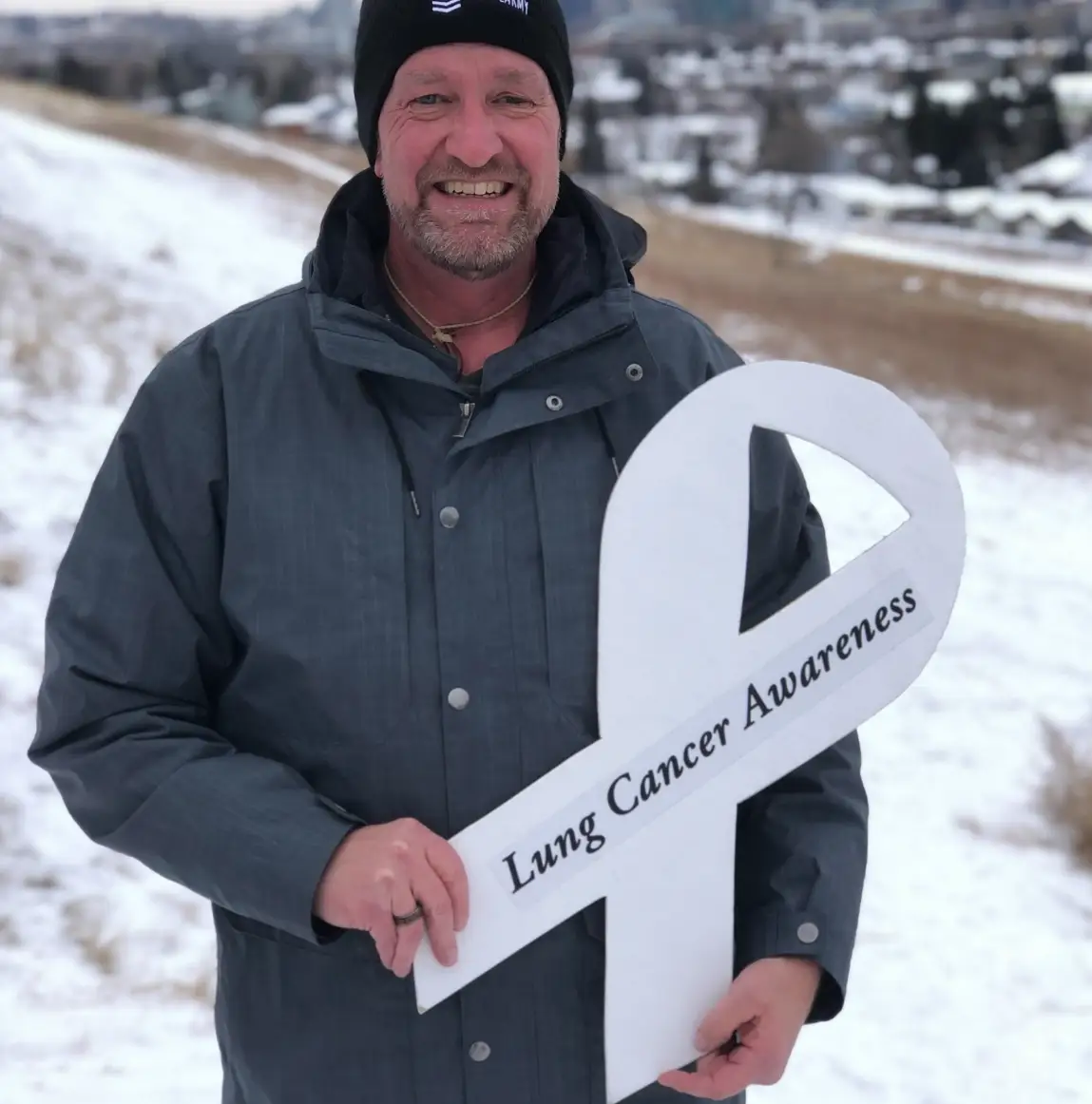 Dave Nitsche holding lung cancer awareness sign