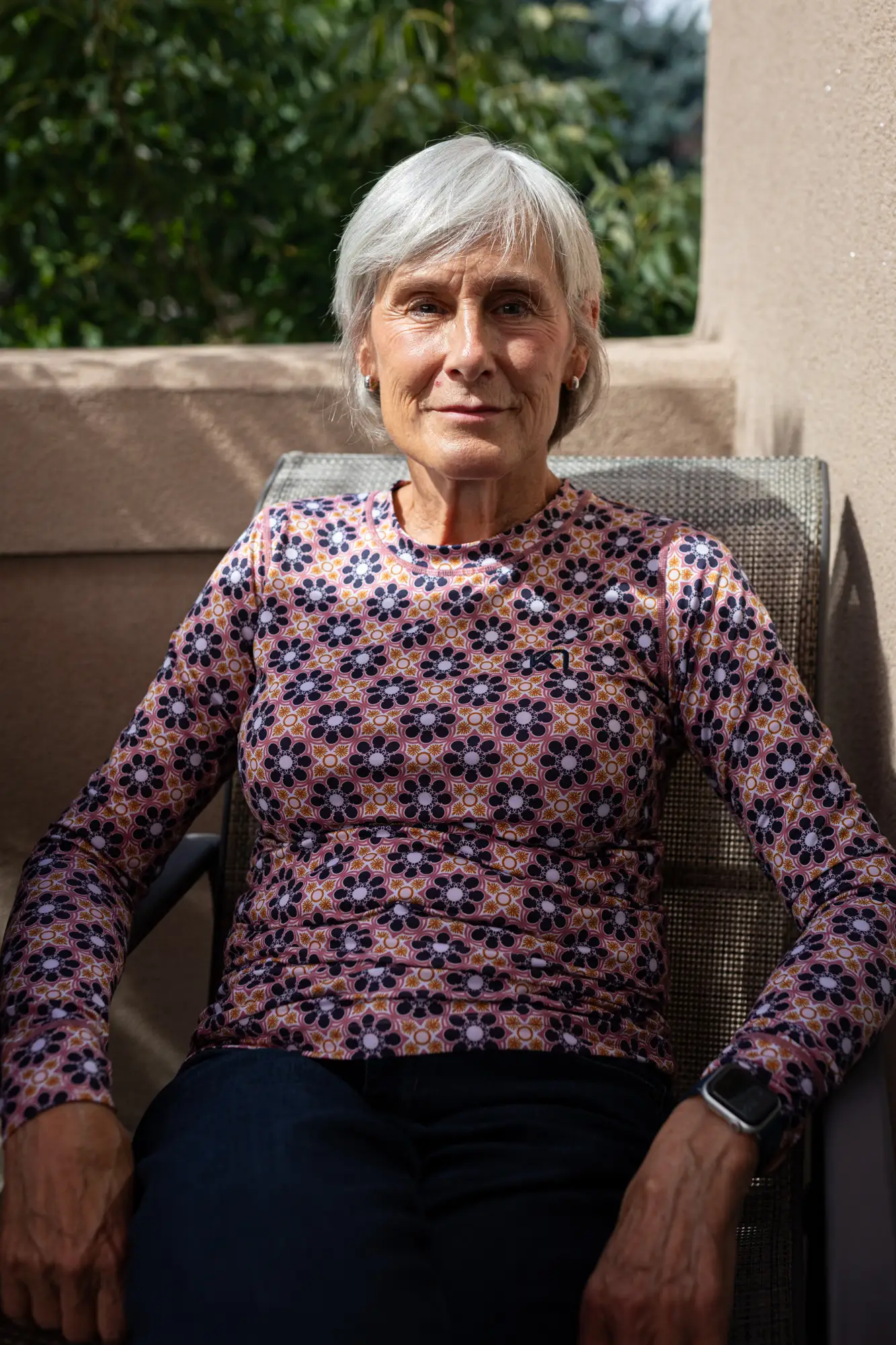A woman posing outside.