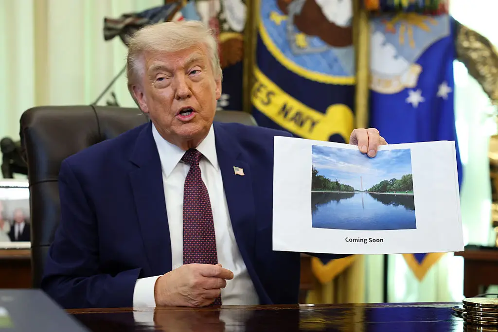 Donald Trump with a rendering of his renovations to the Lincoln Memorial Reflecting Pool.