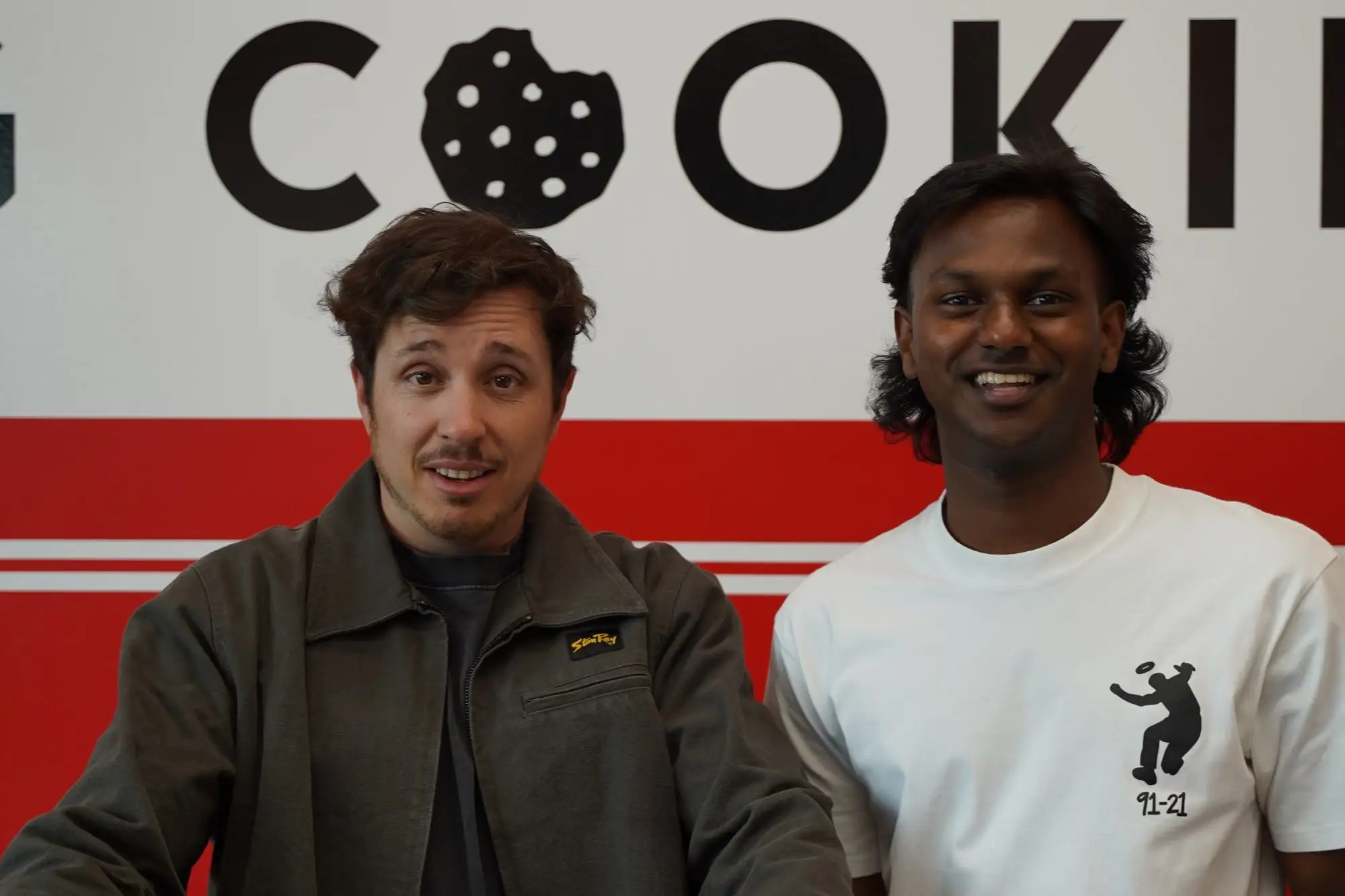 Bang Cookies co-owner Corey Bonalewicz (left) and Gen Z franchisee Kugan Suppiah (right) pose together at the grand opening of Suppiah's store.