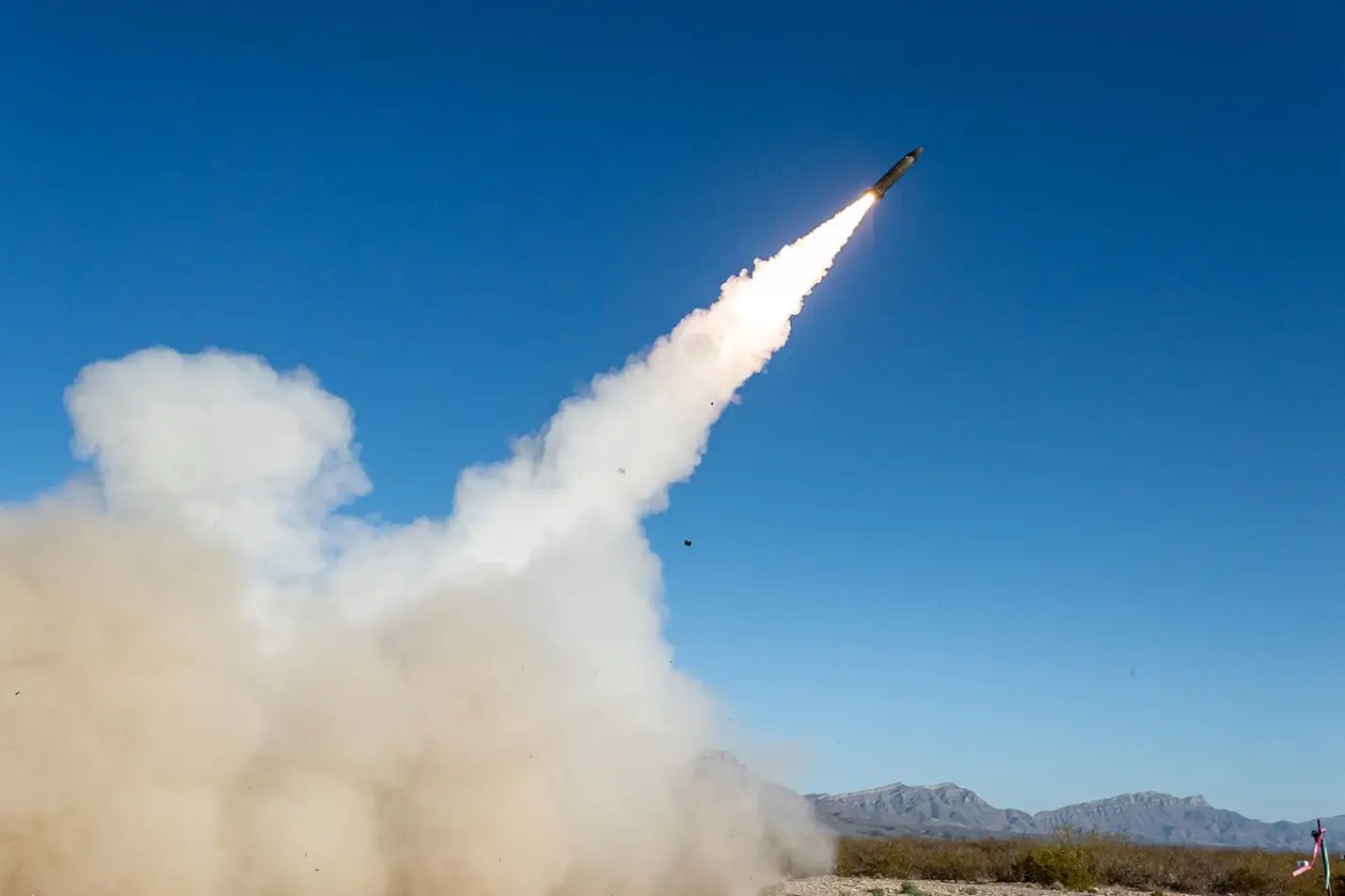 A PRSM fires into the air from a HIMARS launcher.