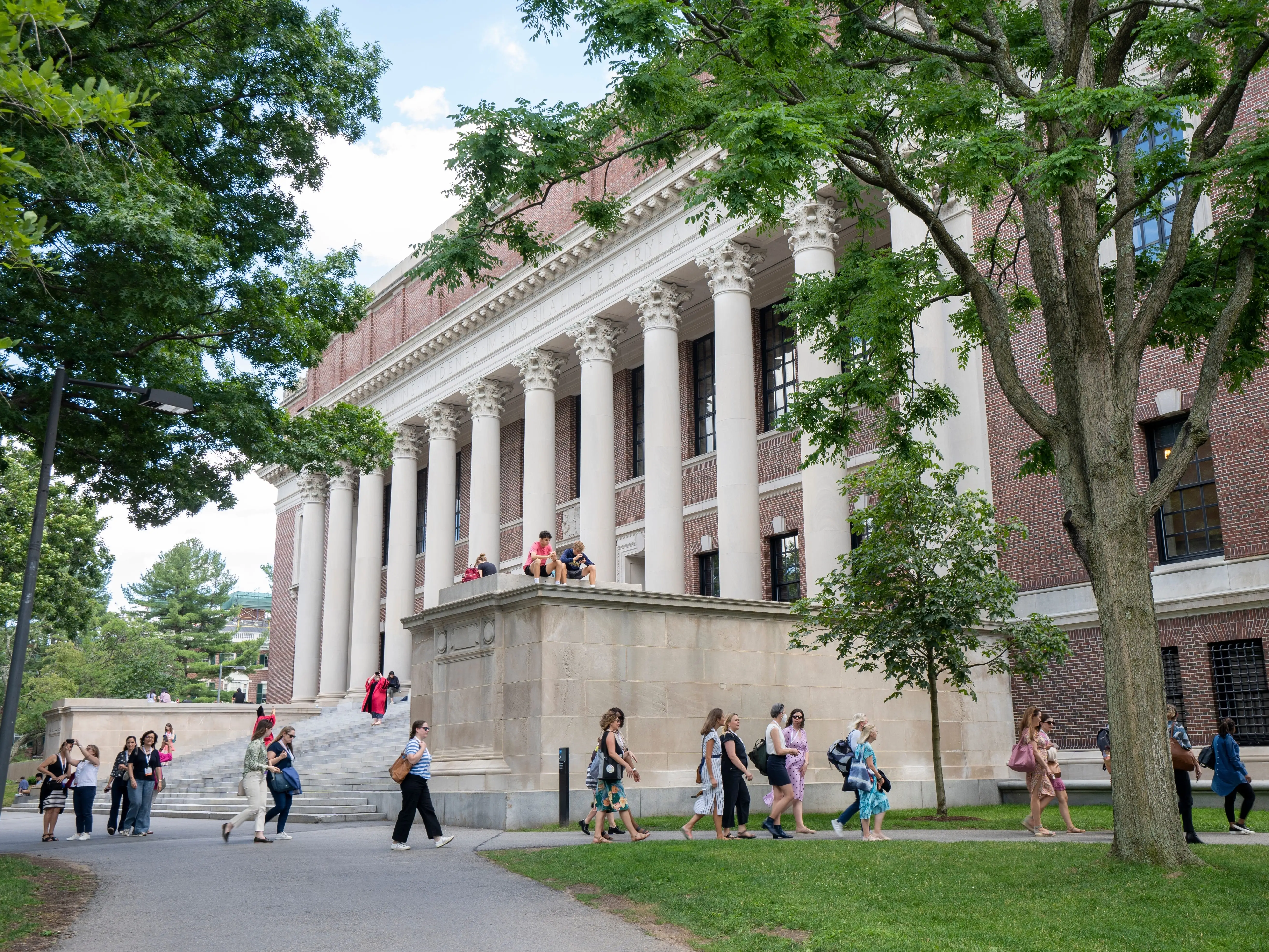People walk on the campus of Harvard University, Cambridge, Massachusetts.