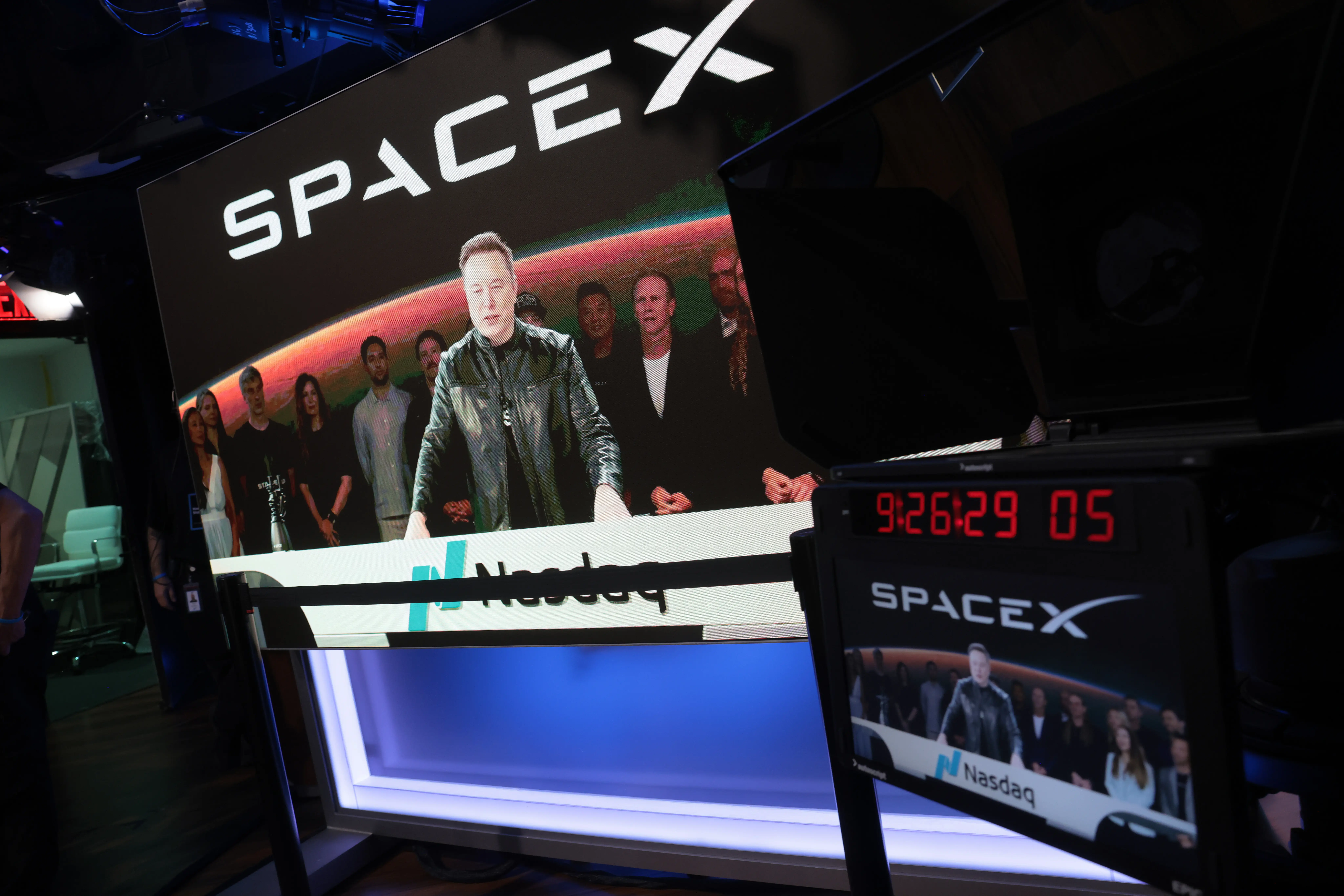 Elon Musk talks at a Nasdaq desk the day of SpaceX's IPO.