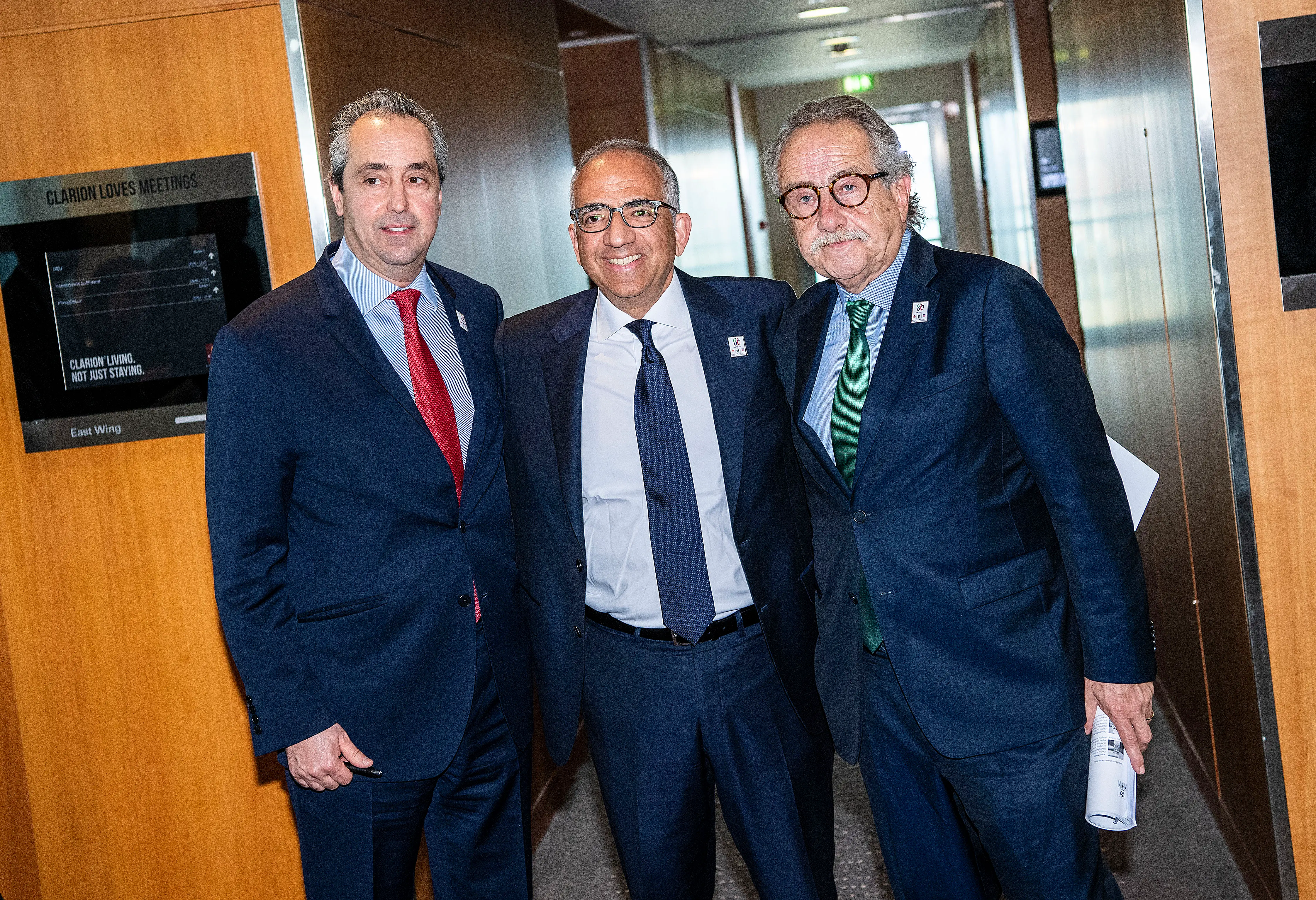 Peter Montopoli, general secretary of the Football Association of Canada; Carlos Cordeiro; and Decio de Maria, president of the Football Association of Mexico, pose.