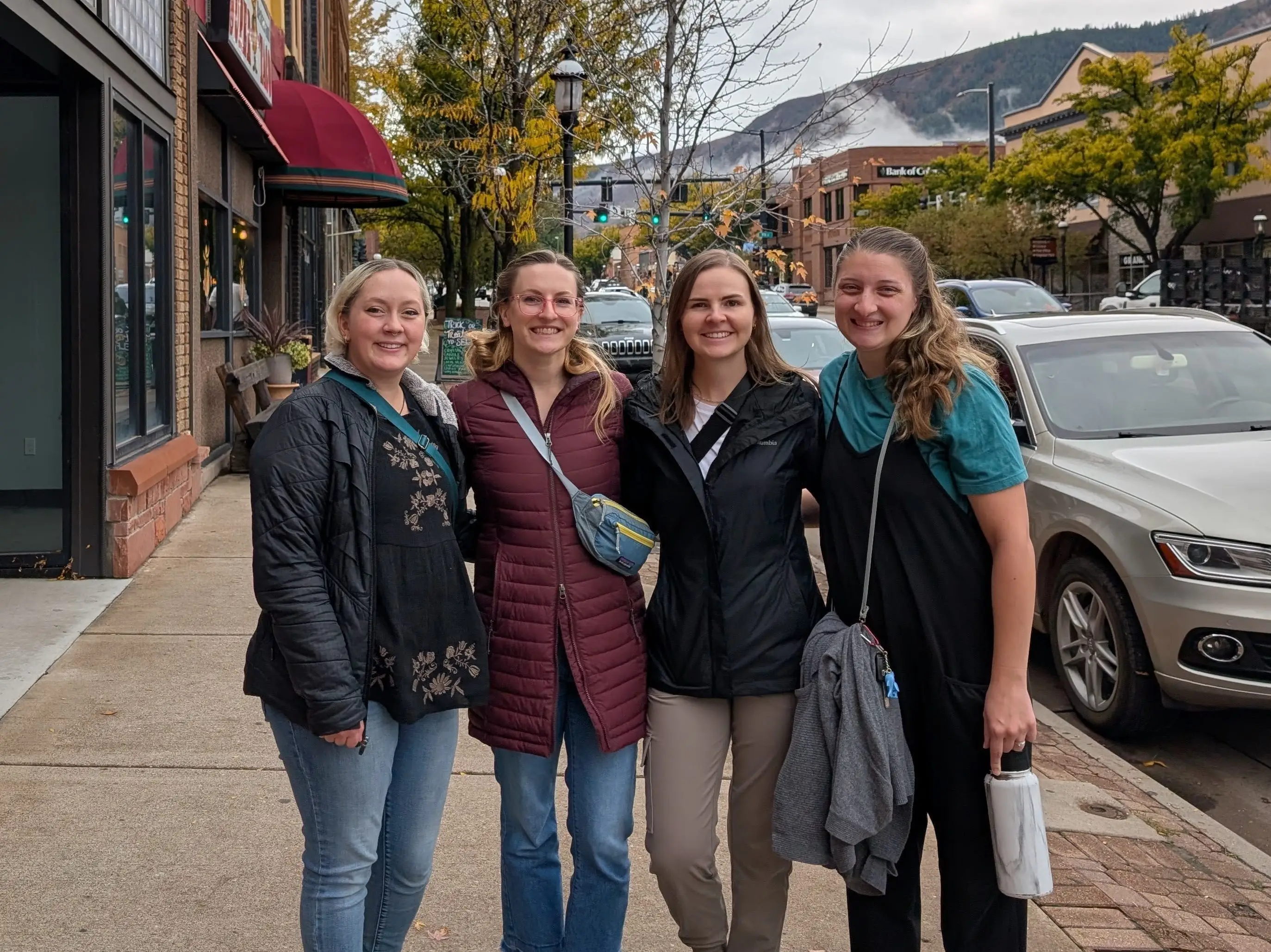 Four friends pose together in Glenwood Springs, Colorado.
