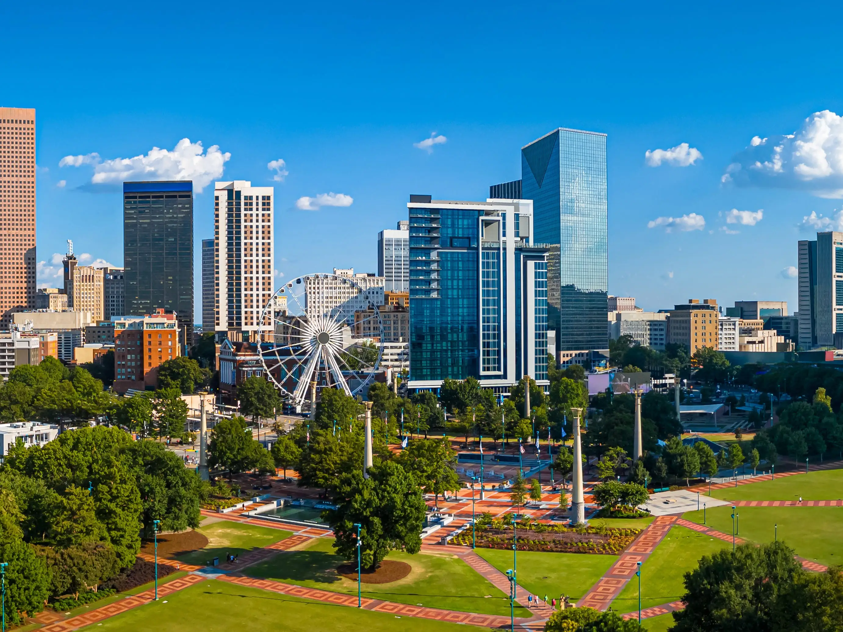 Atlanta Skyline with Midtown Towers Above Lush Urban Park in Summer Light