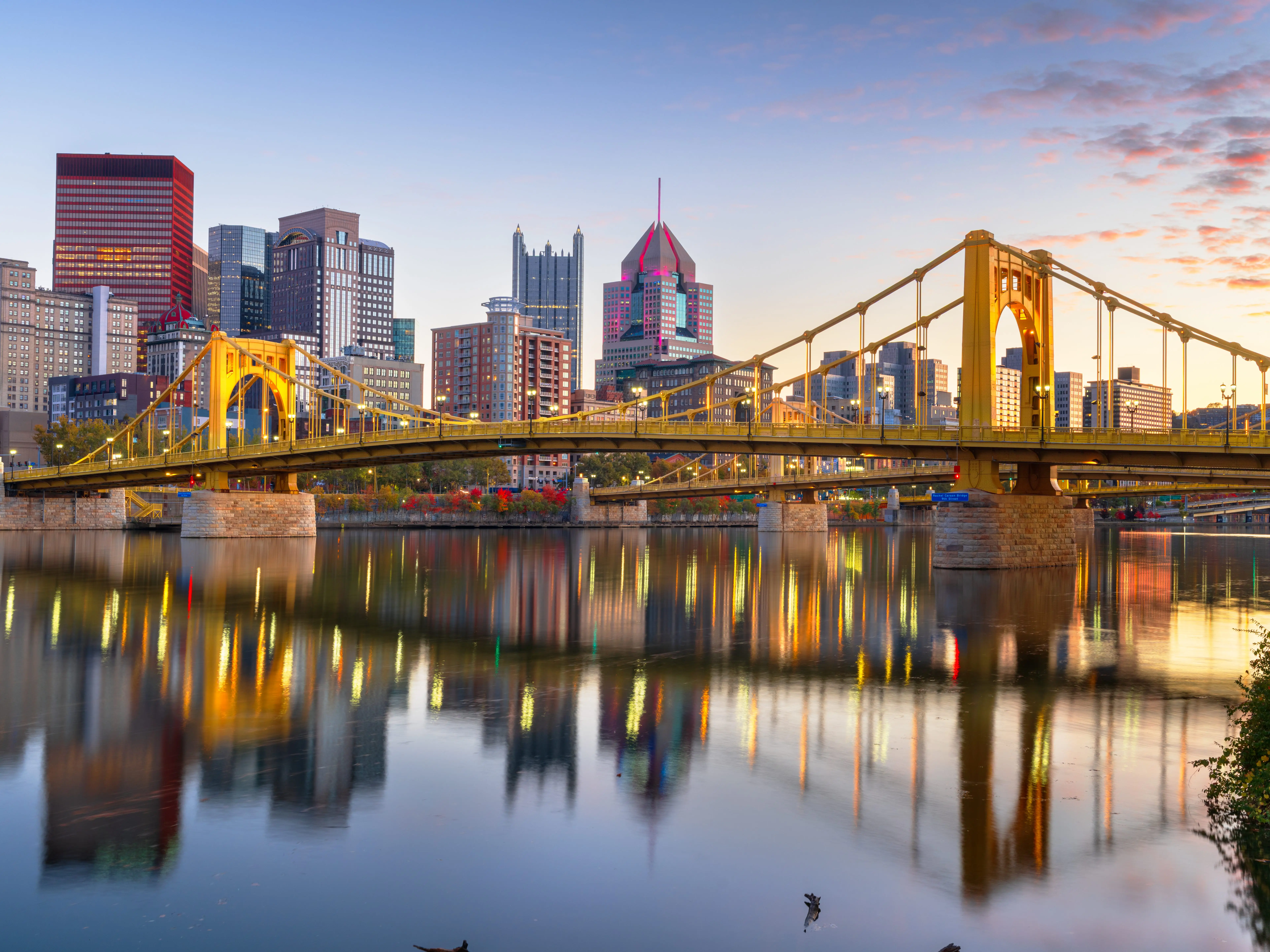 Pittsburgh, Pennsylvania, USA downtown city skyline on the Ohio River at dusk.