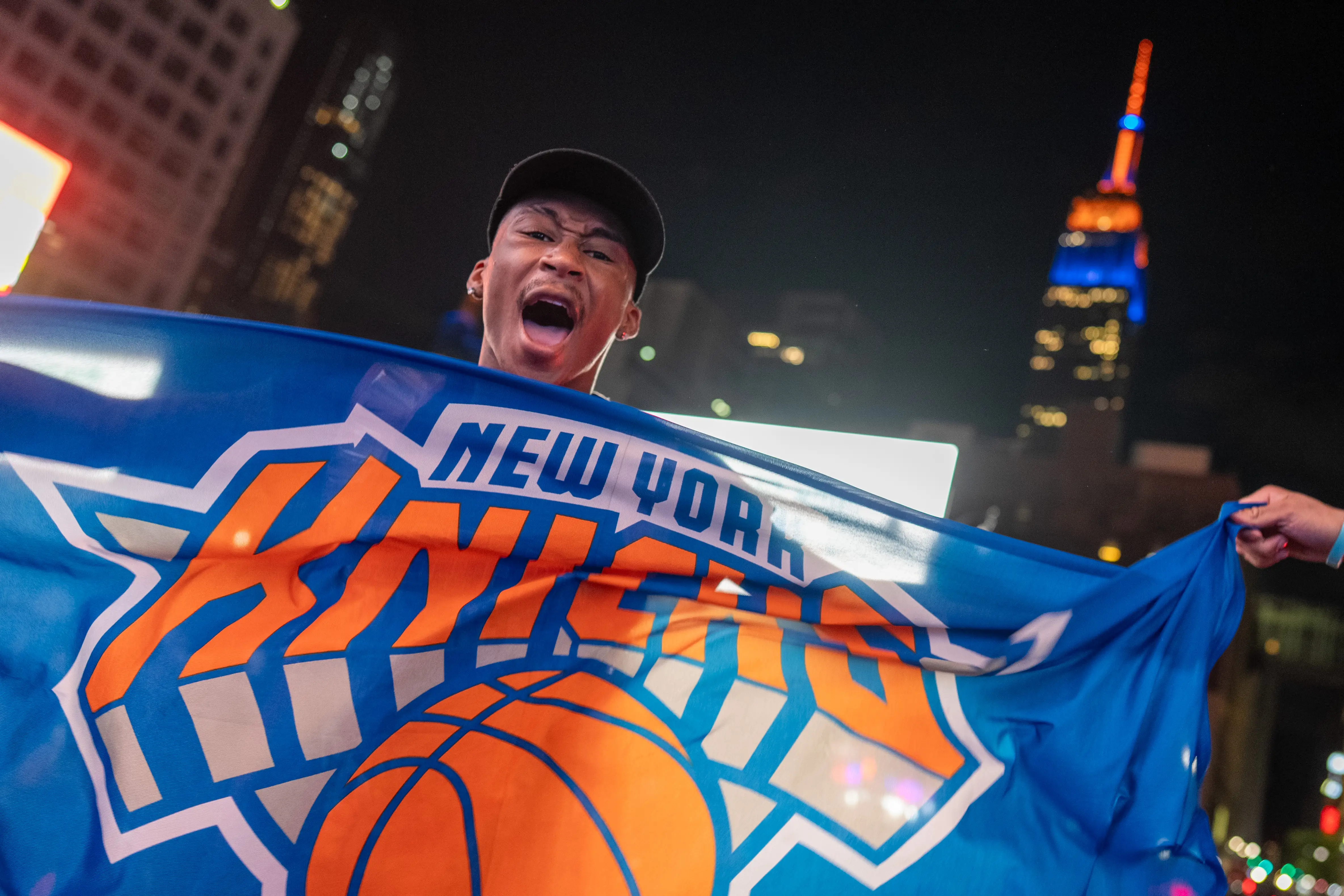 A Knicks fan celebrates the championship in New York City