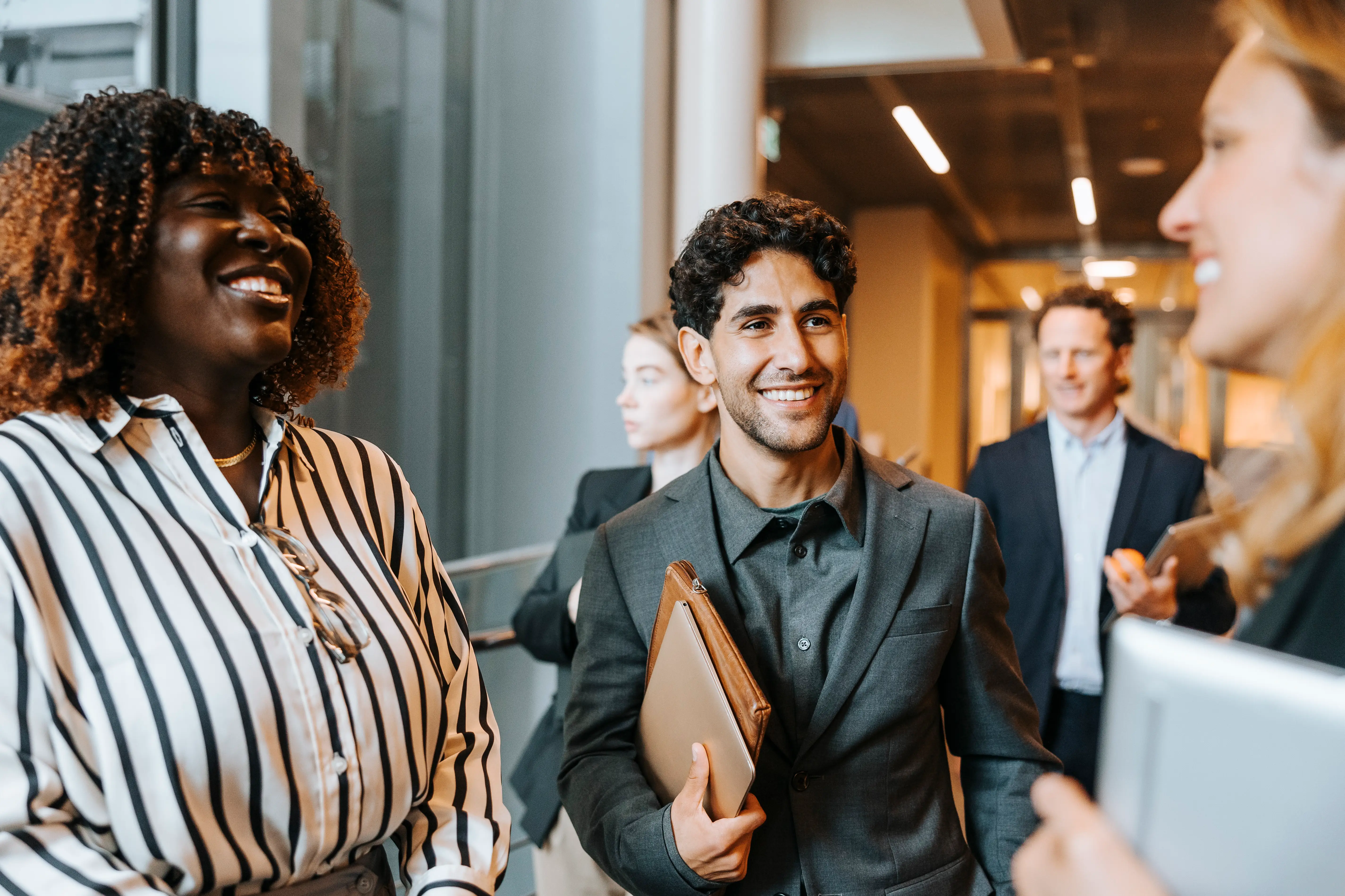 A group of young professionals laughing.
