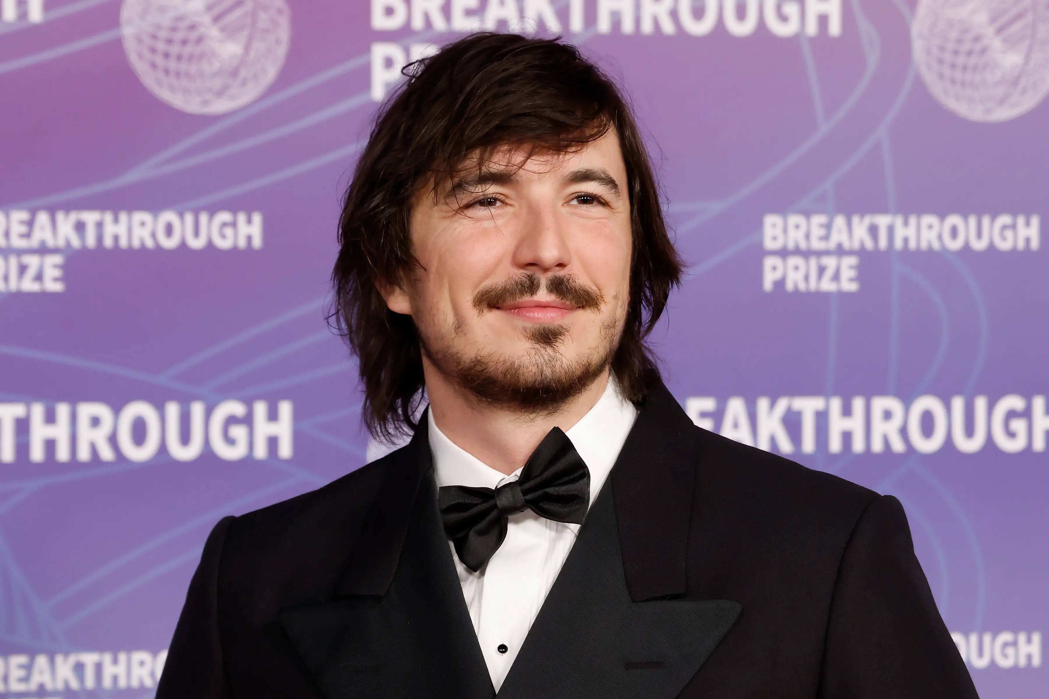 Robinhood CEO Vlad Tenev in front of a step-and-repeat.