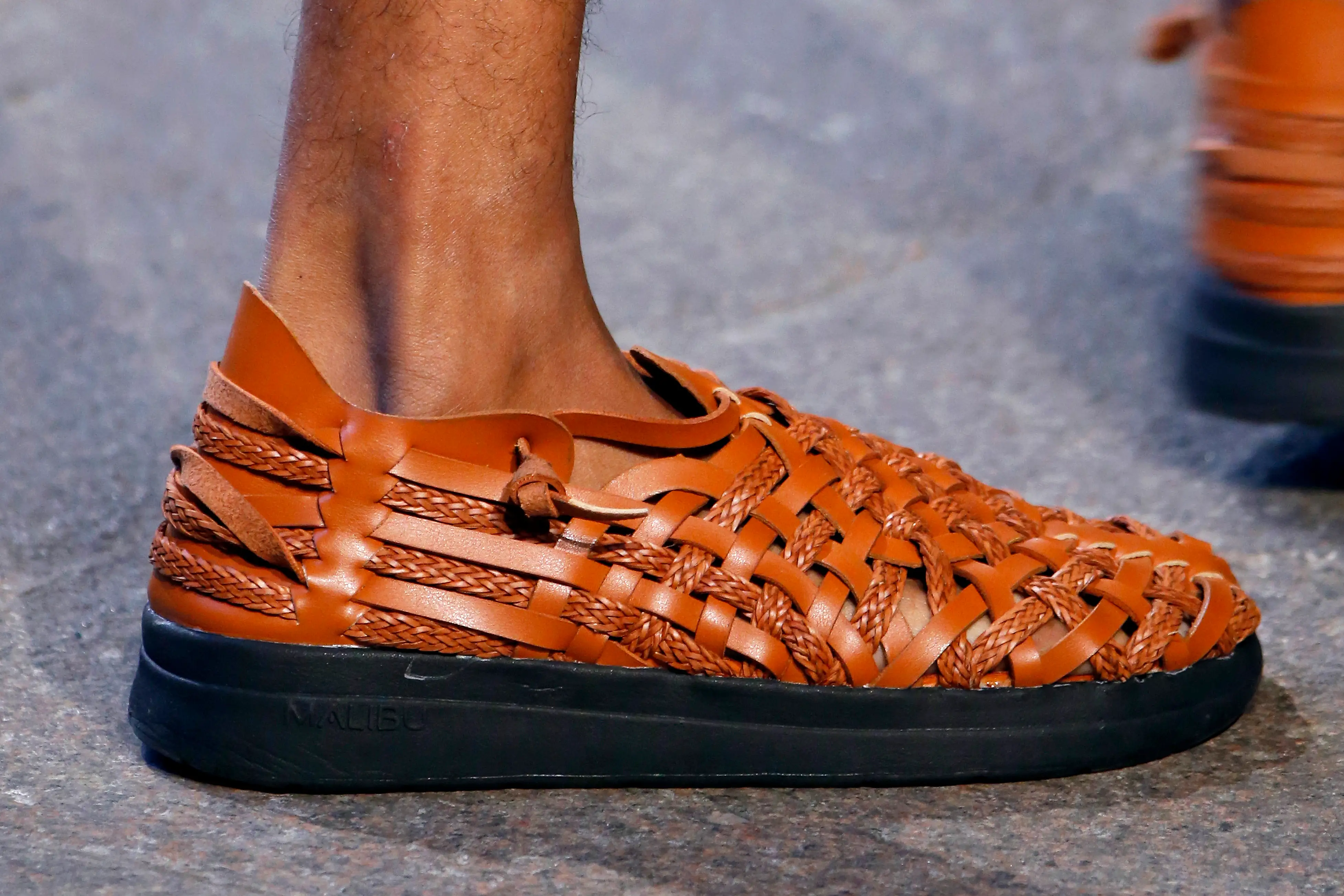 Braided leather sandal on foot