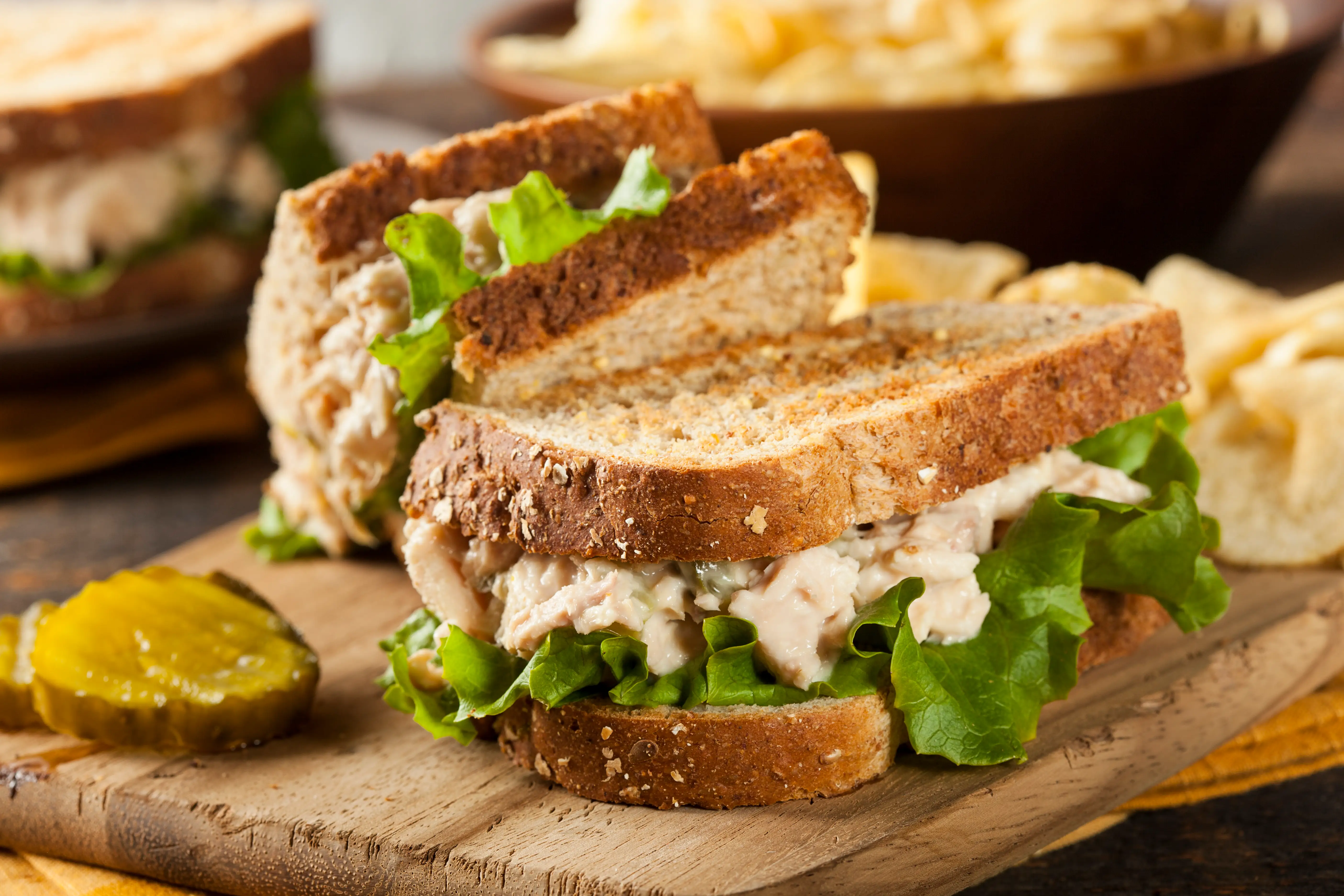 a whole grain sandwich on a cutting board